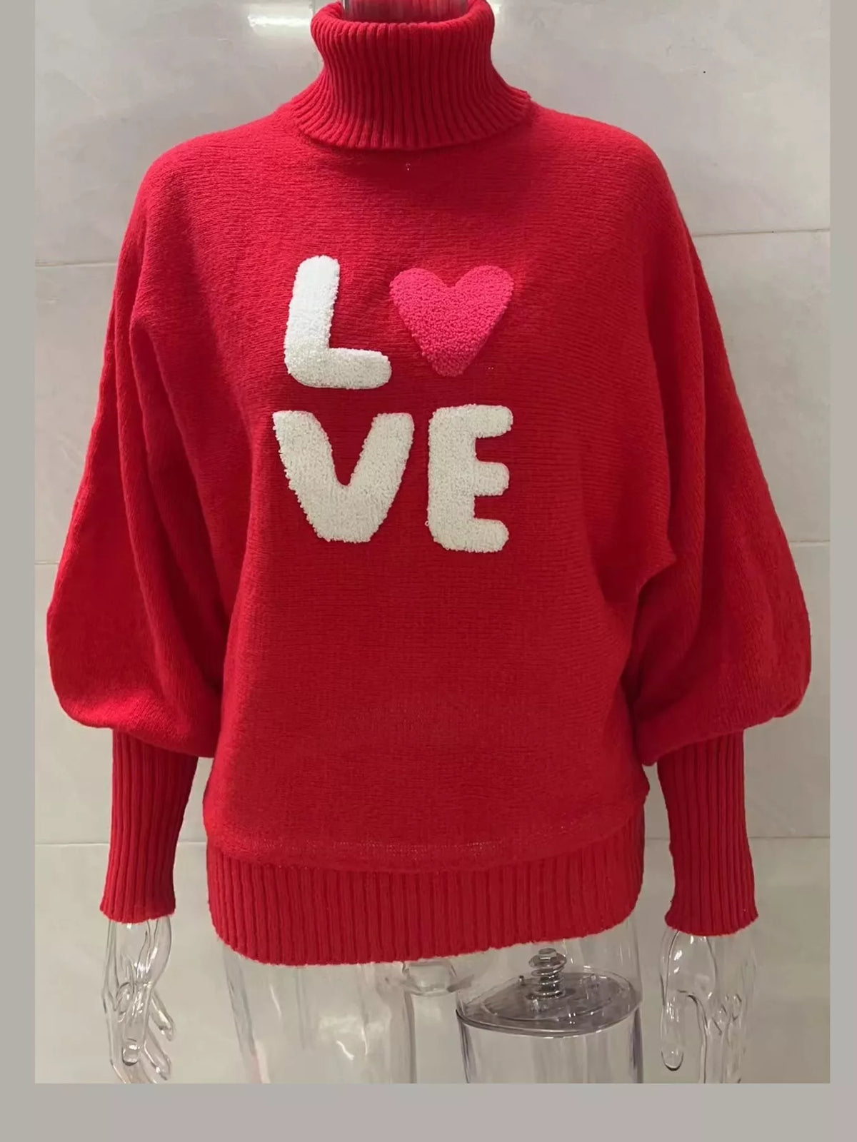 Red LOVE lettering turtleneck sweater
