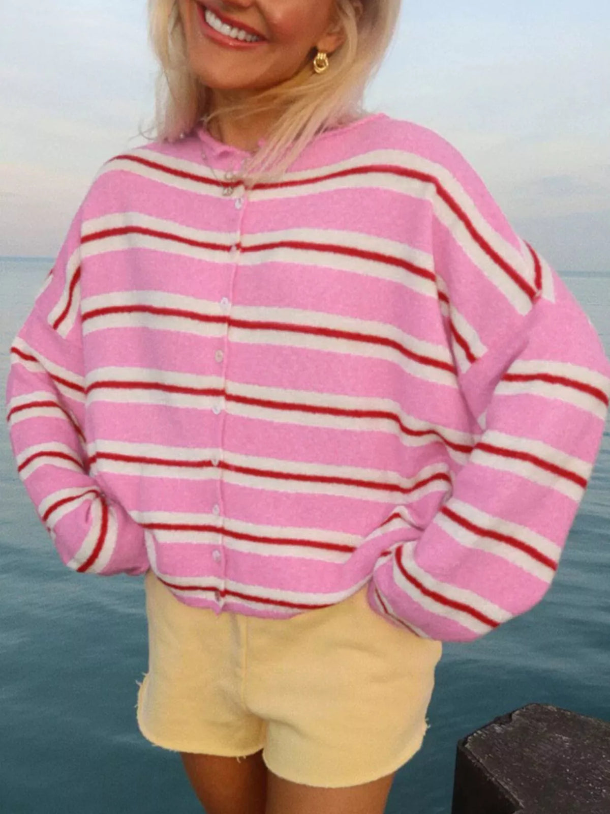 Pink striped button-front cardigan, front view