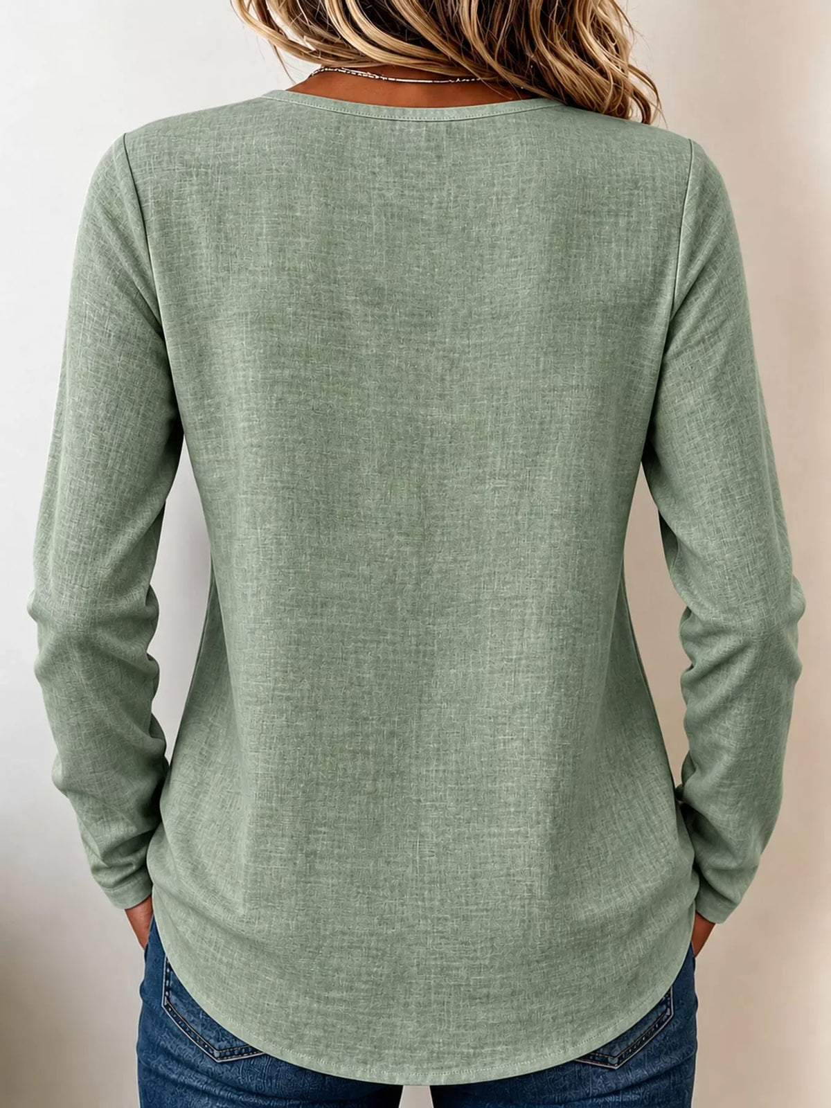 Green long sleeve decorative button blouse, back view