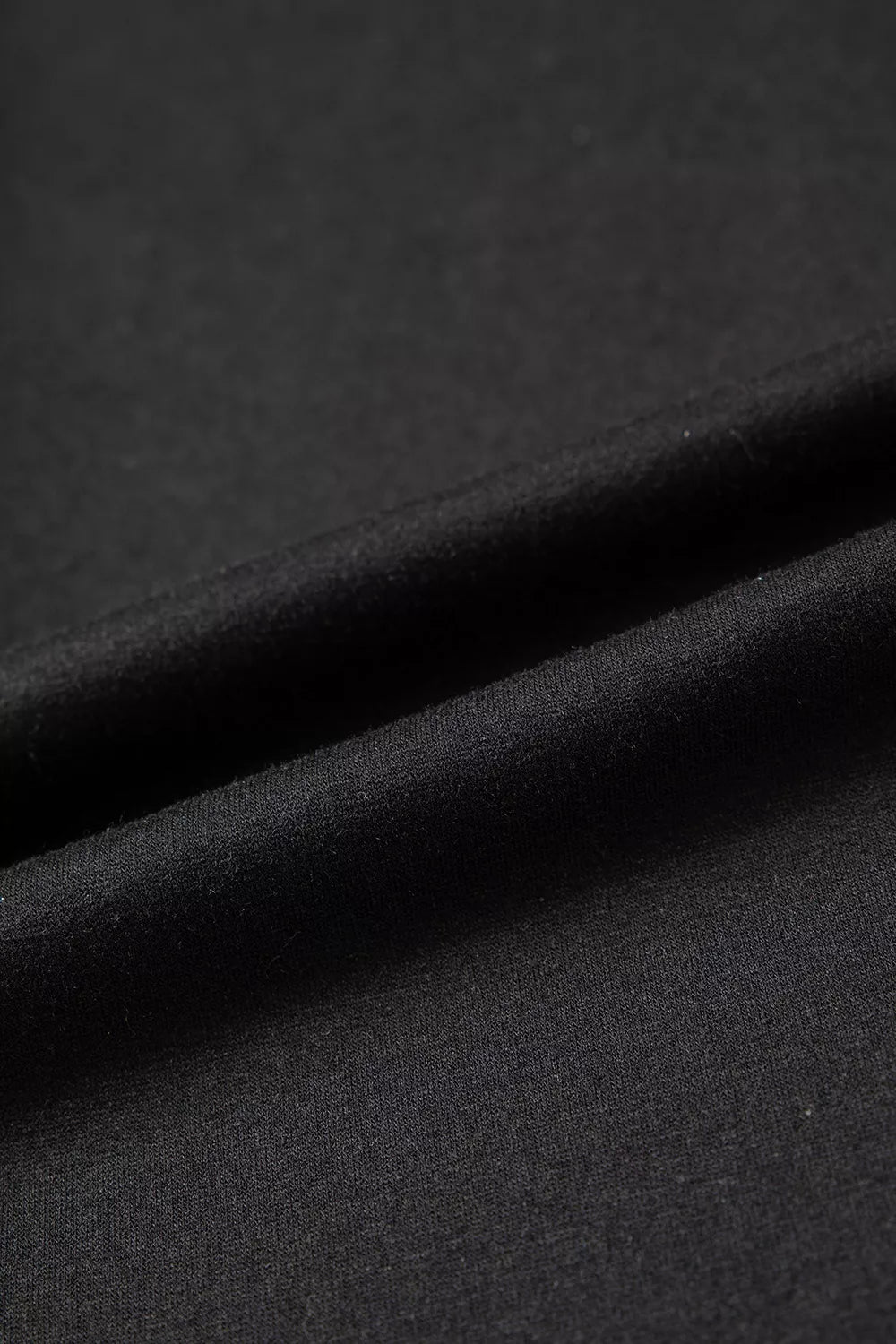 Black off-shoulder button-detail three-quarter sleeve top, fabric detail