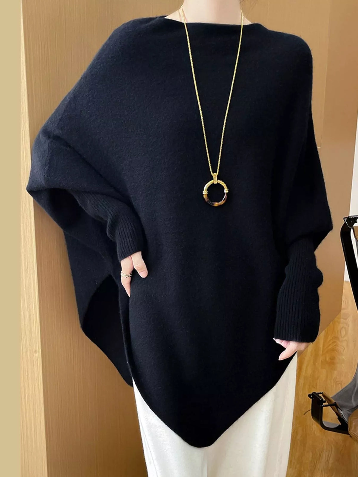Navy asymmetrical lantern sleeve sweater — front view