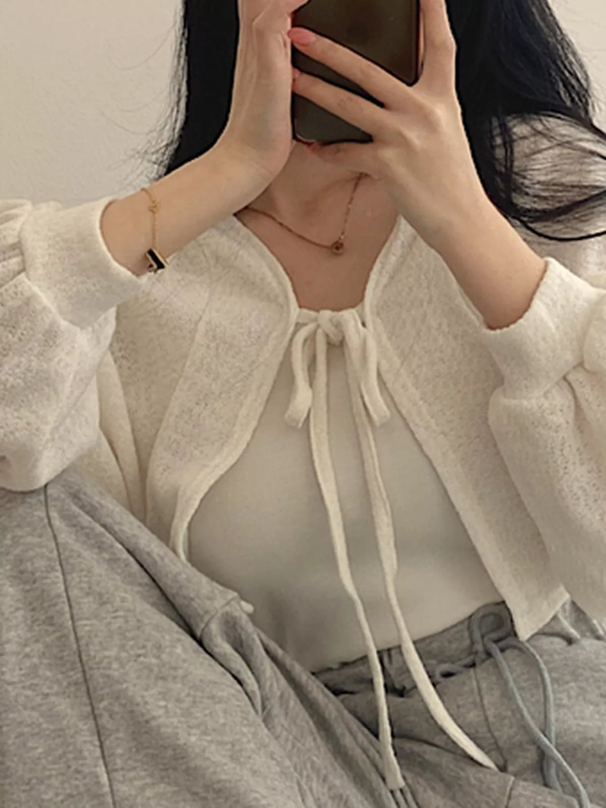 Round neck long sleeve cardigan, front view on model