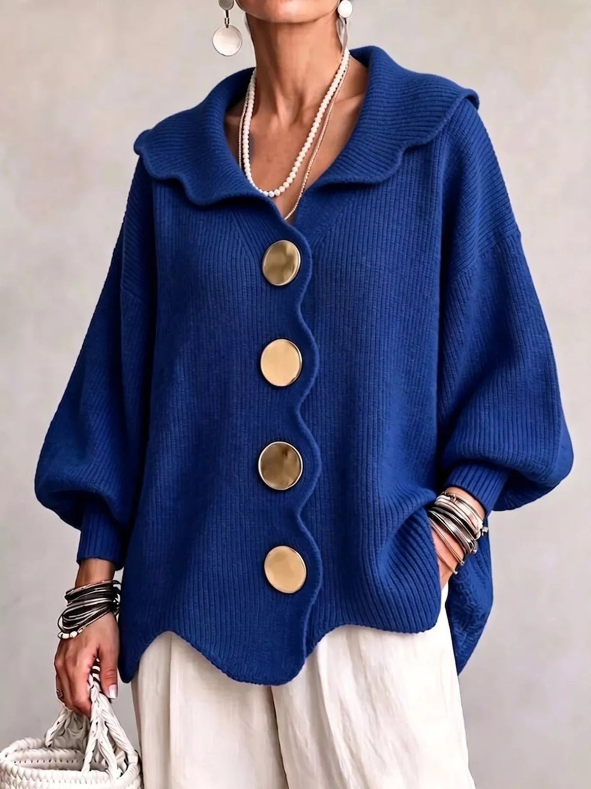 Blue scalloped-edge knit cardigan, front view