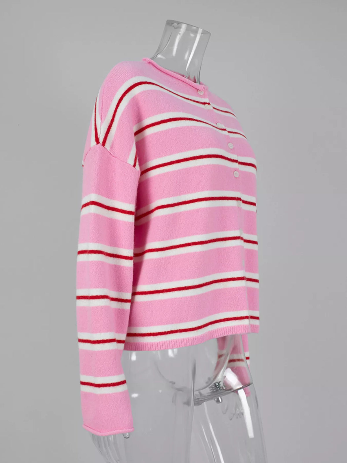 Pink striped button-front cardigan, side view on mannequin