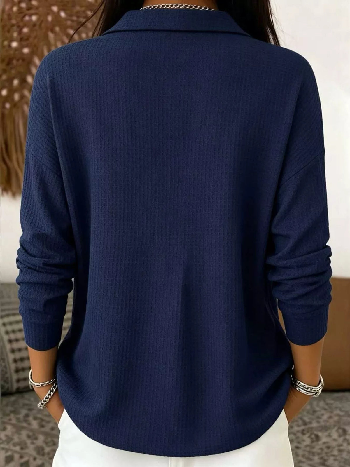 Navy waffle knit snap-front blouse, back view