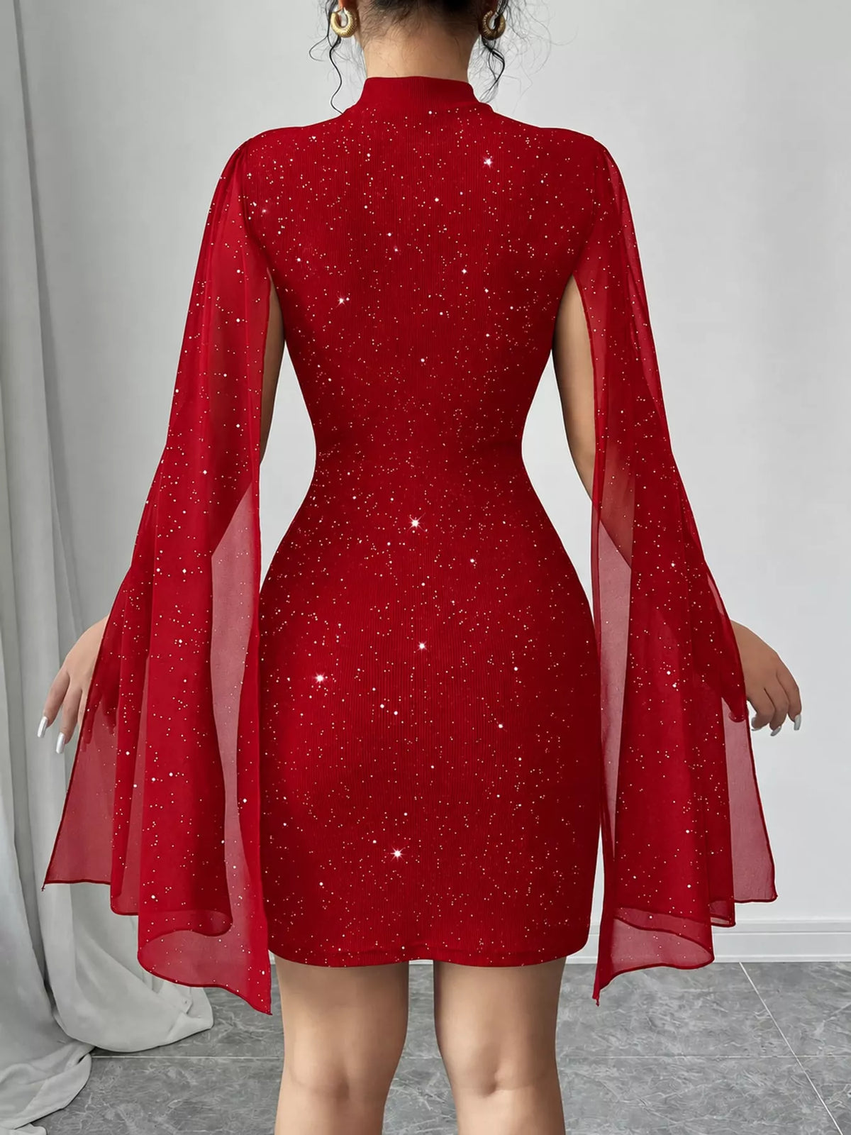 Red glitter mock neck cape-sleeve mini dress — back view