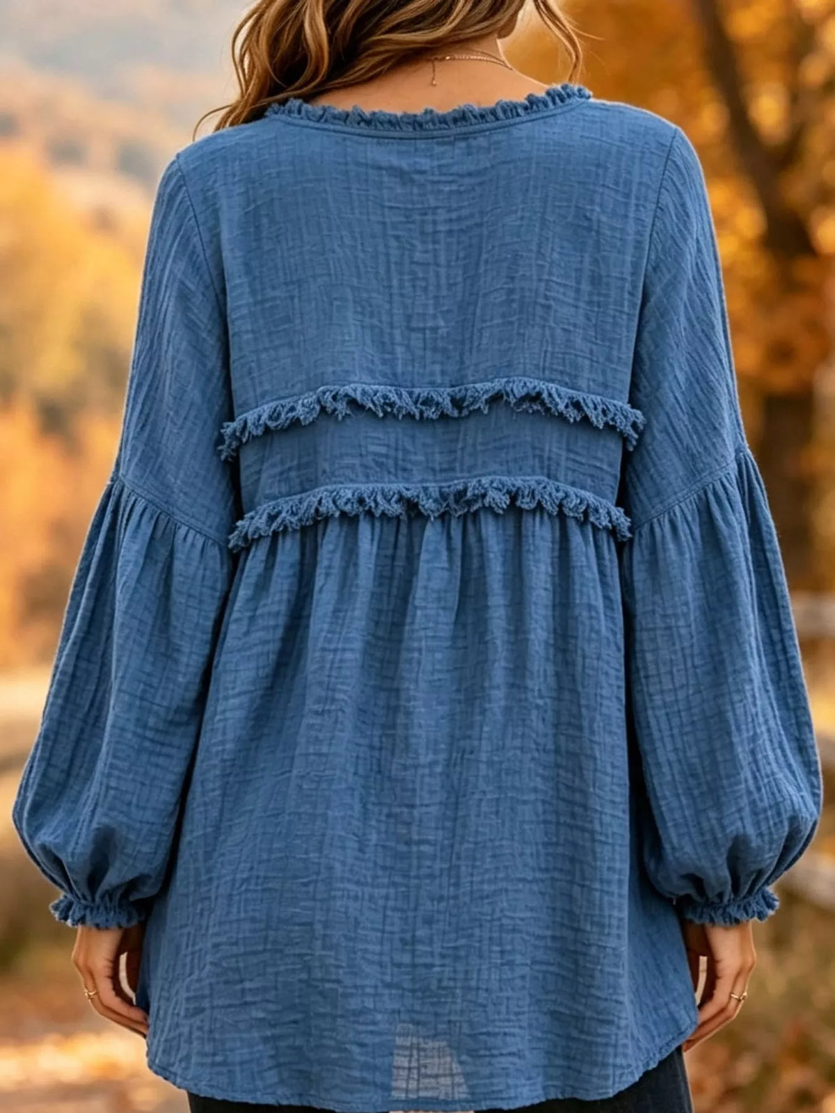 Blue textured frayed-trim peplum blouse, back view