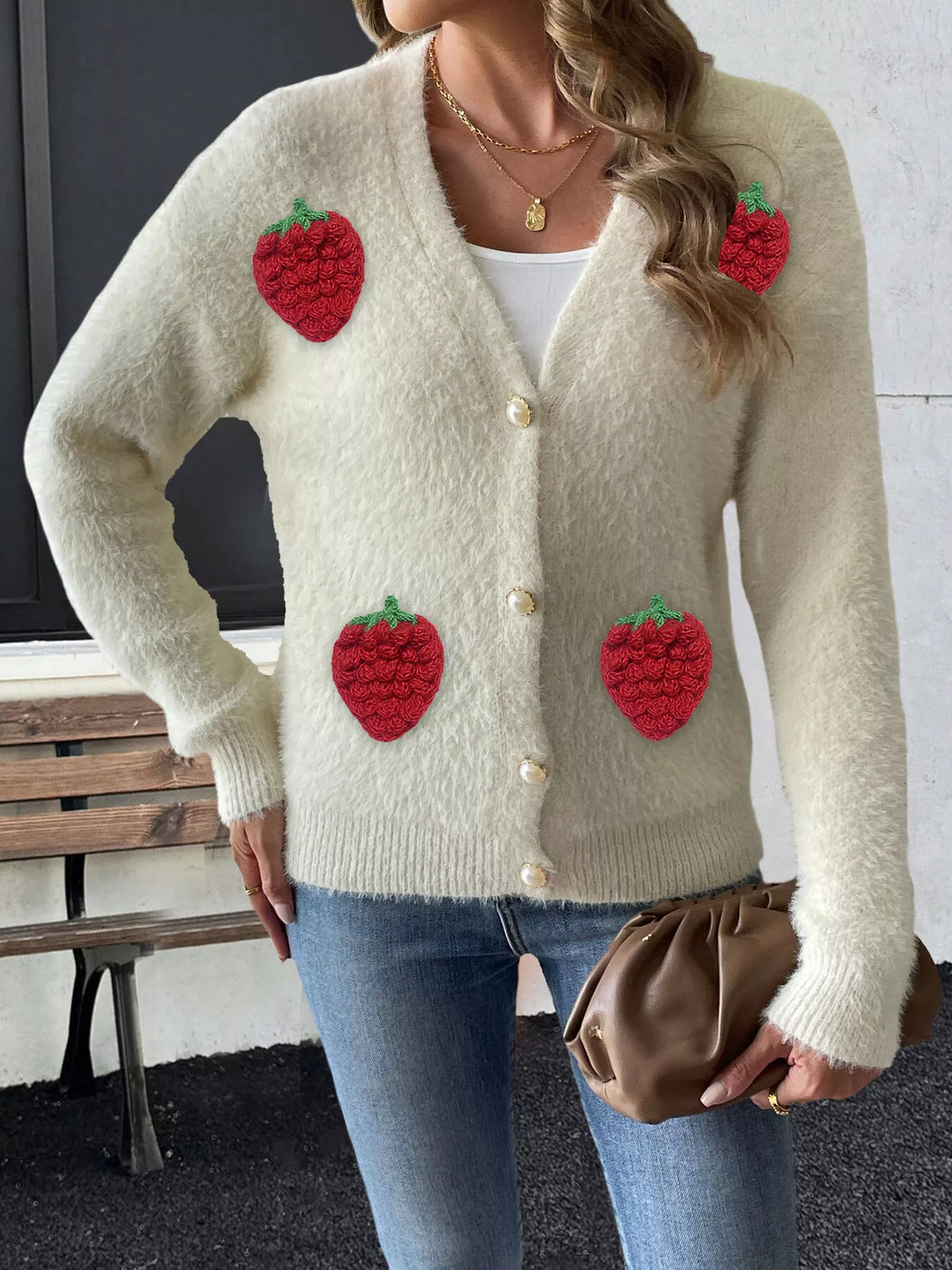 Cream strawberry-applique cardigan, buttoned front view