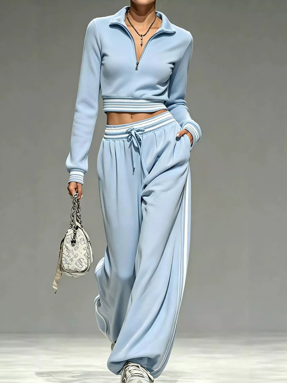 Blue half-zip crop top and pants set, full front view