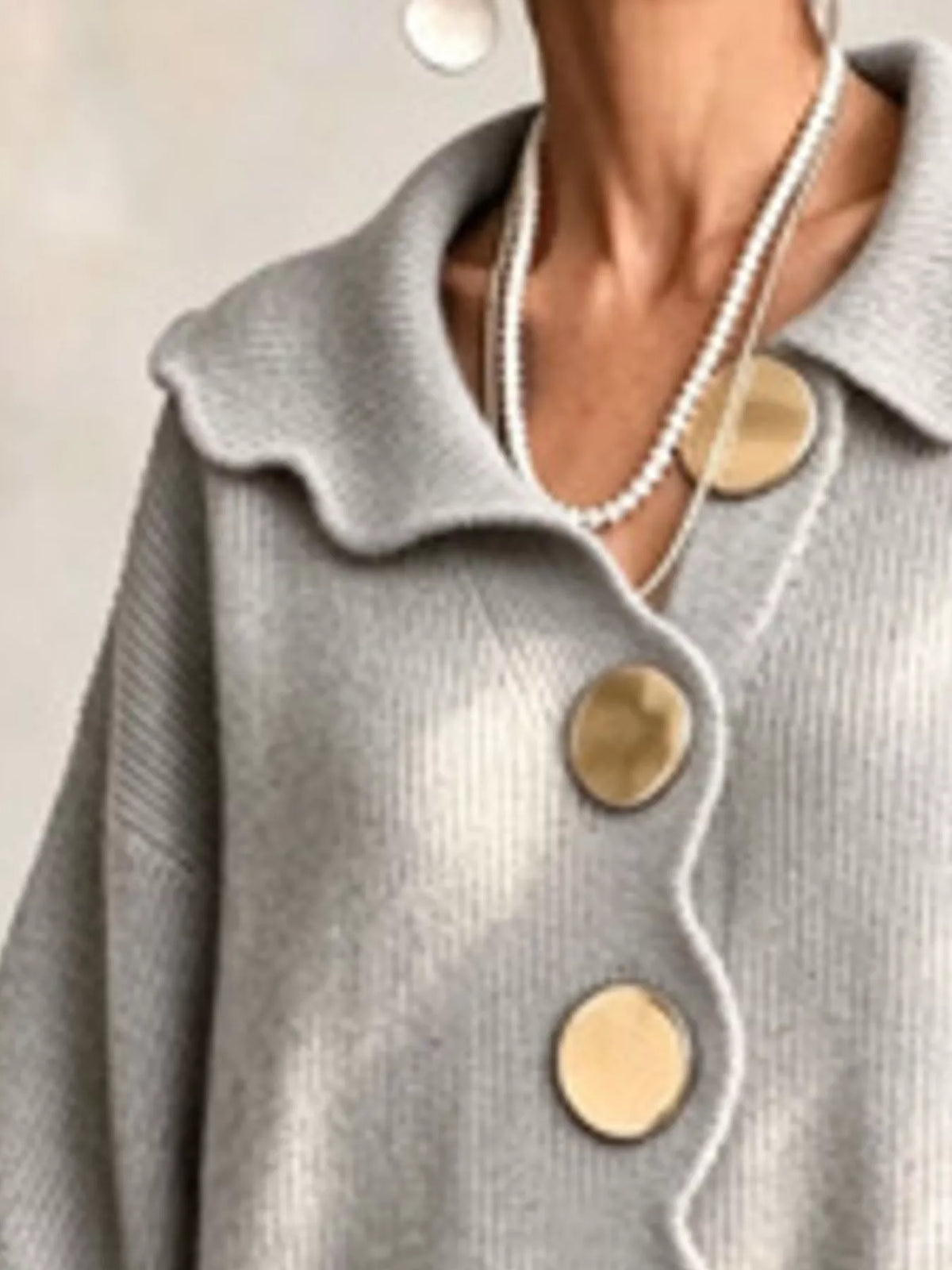 Gray scalloped-edge knit cardigan, collar detail