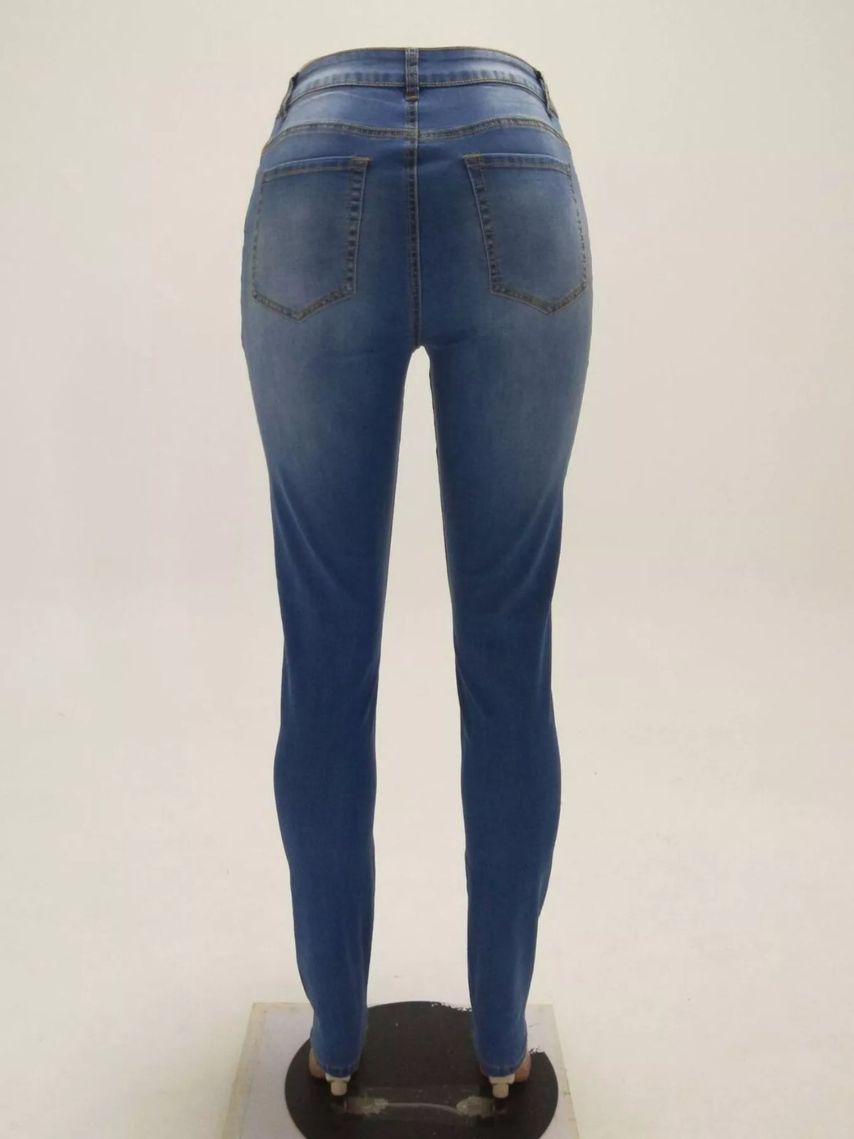 High-Waisted Skinny Jeans in blue, dress form back view