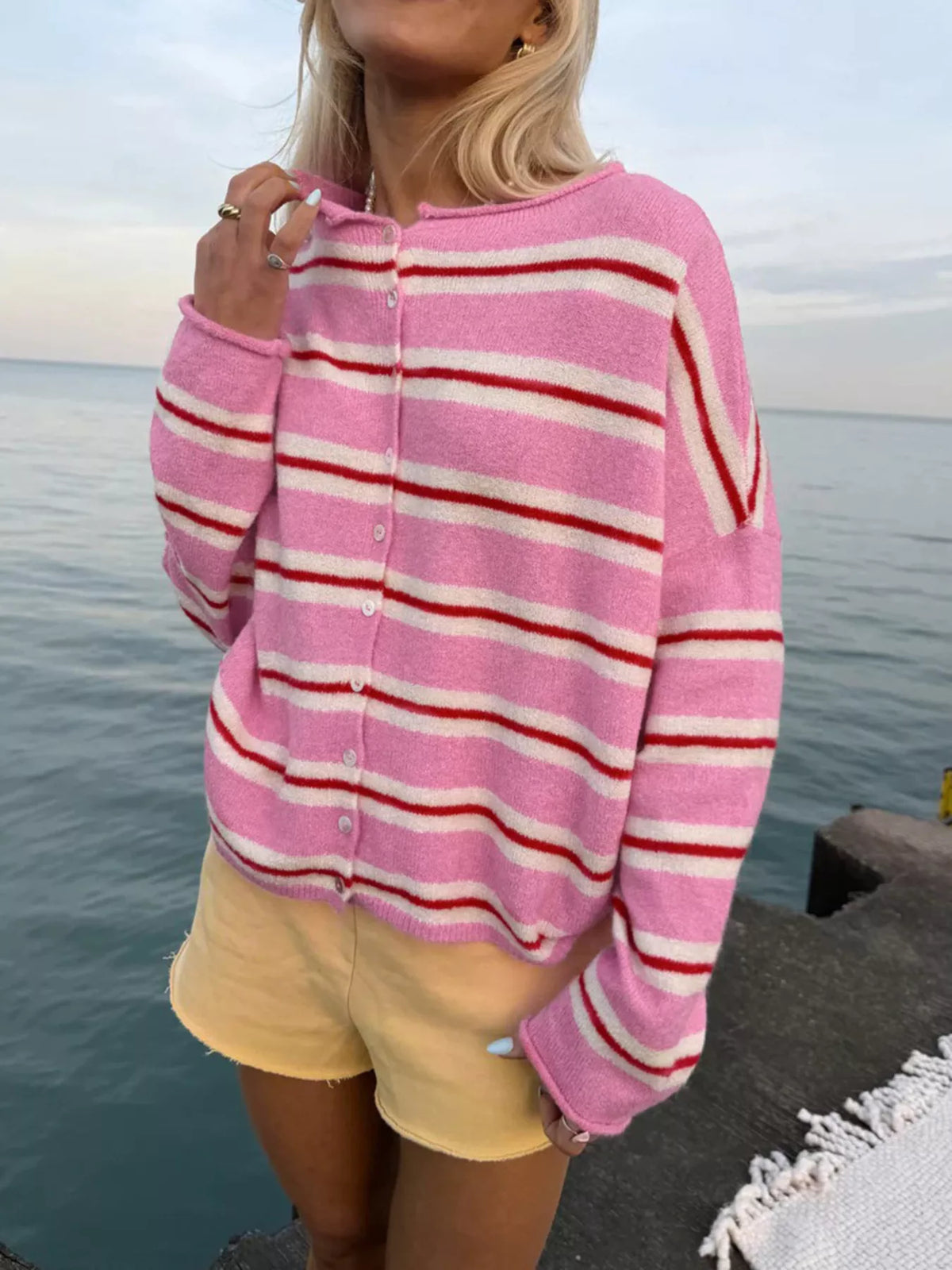 Pink striped button-front cardigan, neckline detail