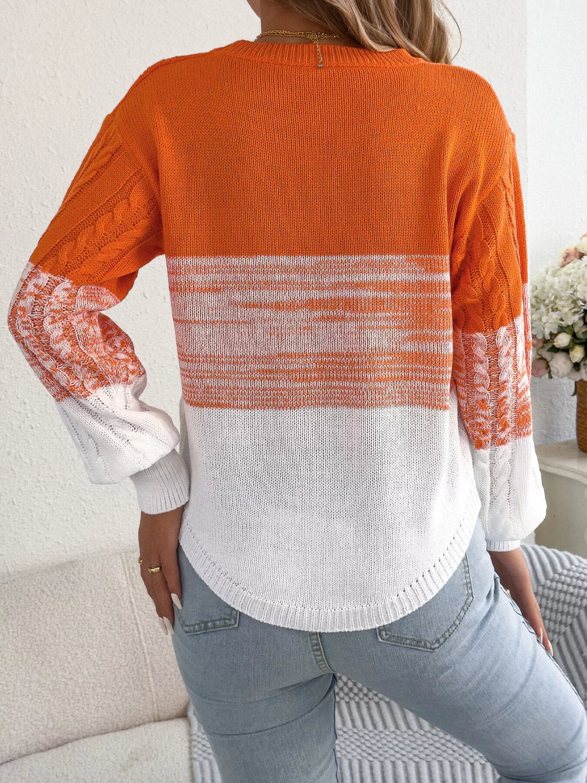 Orange color block cable knit sweater, back view