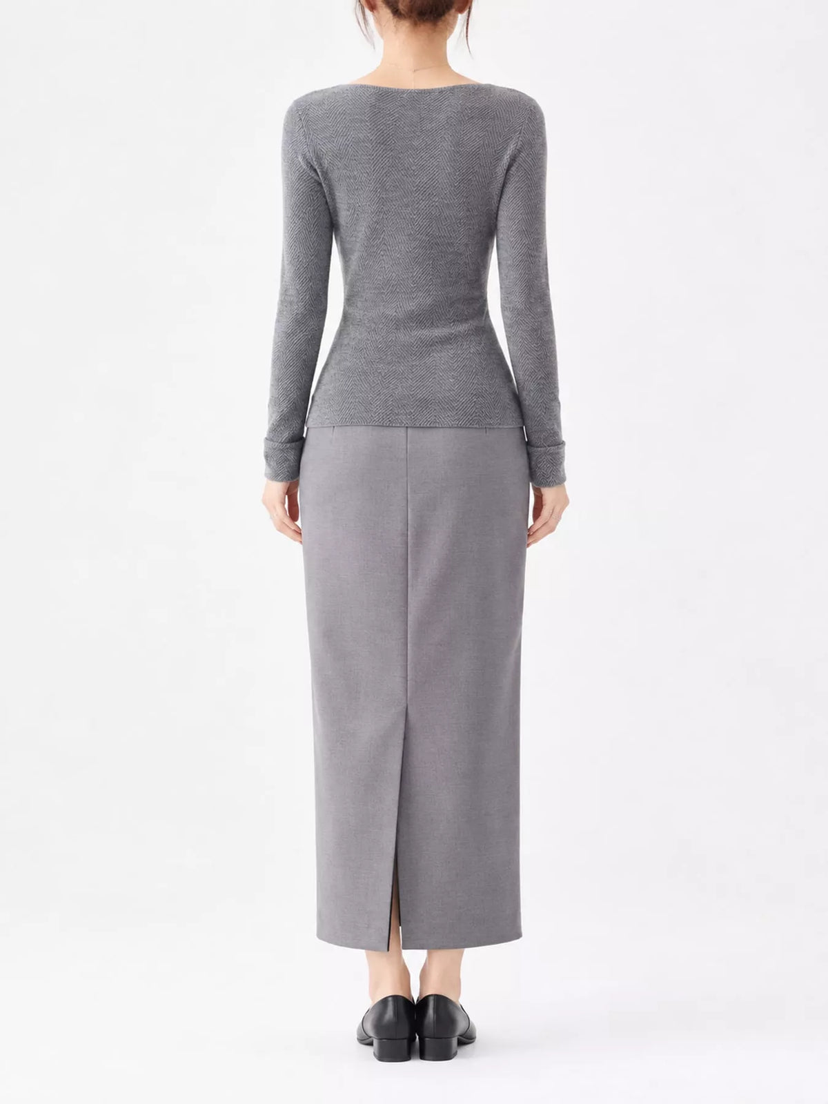 Gray herringbone knit sweater, back view