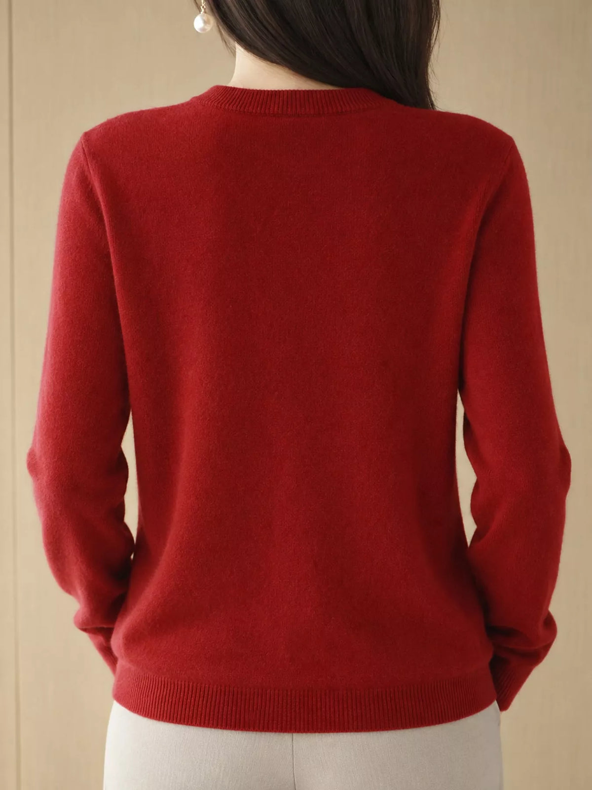Red crew neck button-front cardigan, back view