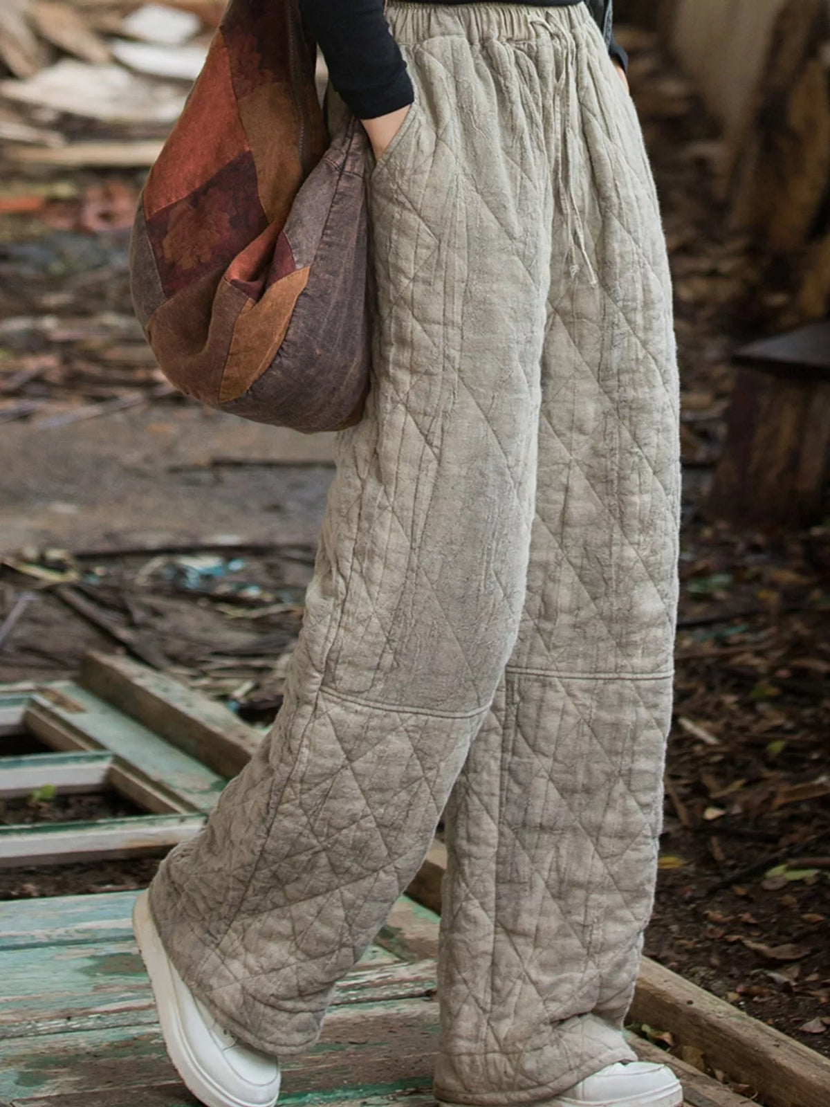 Beige quilted wide-leg pants, side view