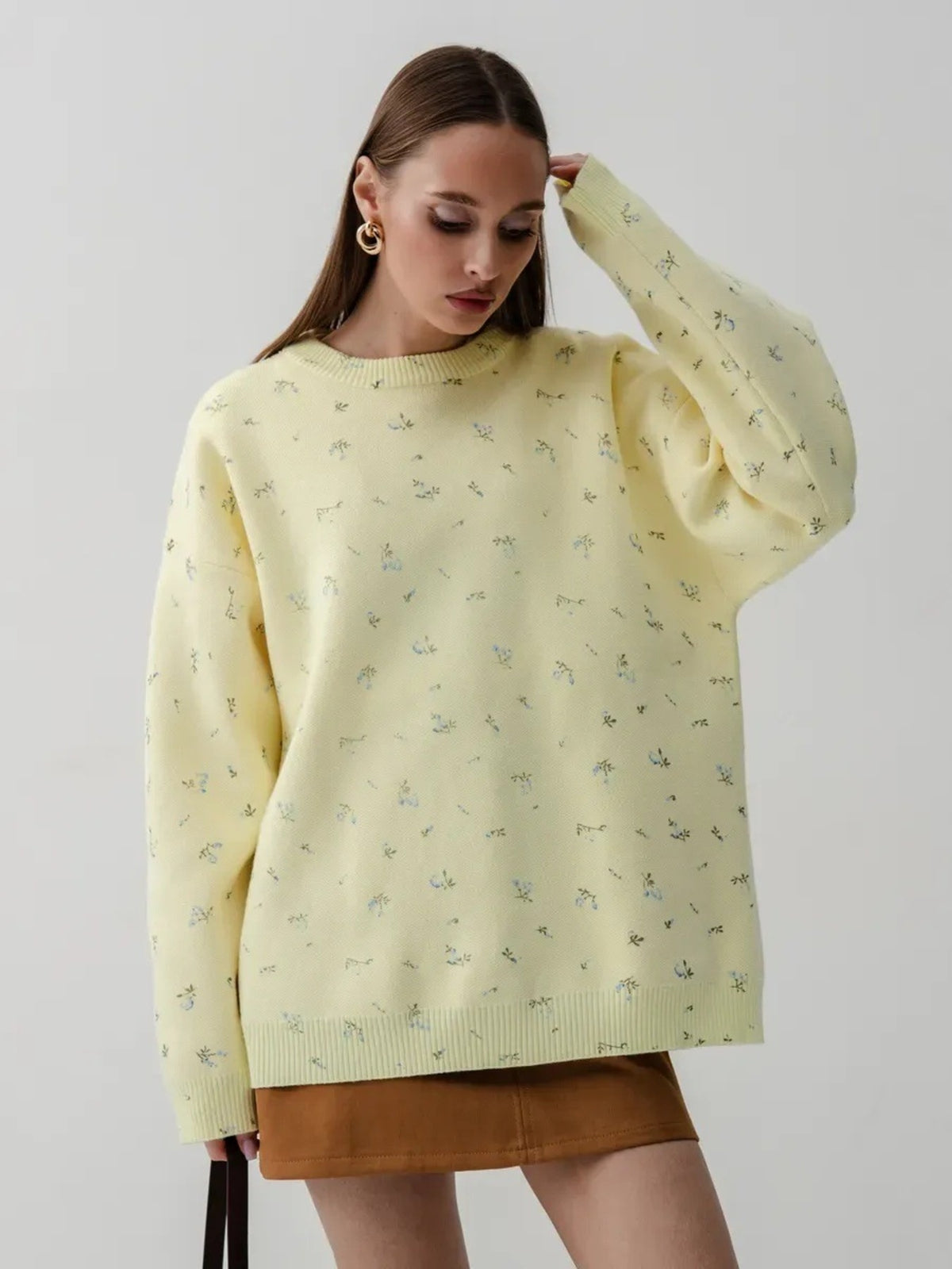 Yellow floral dropped-shoulder oversized sweater, standing front view.