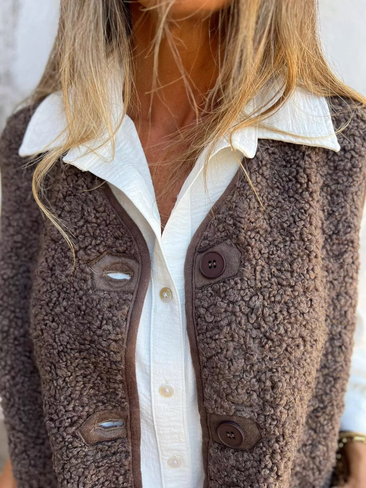 Women's Sherpa Button-Down Vest in brown — button detail view