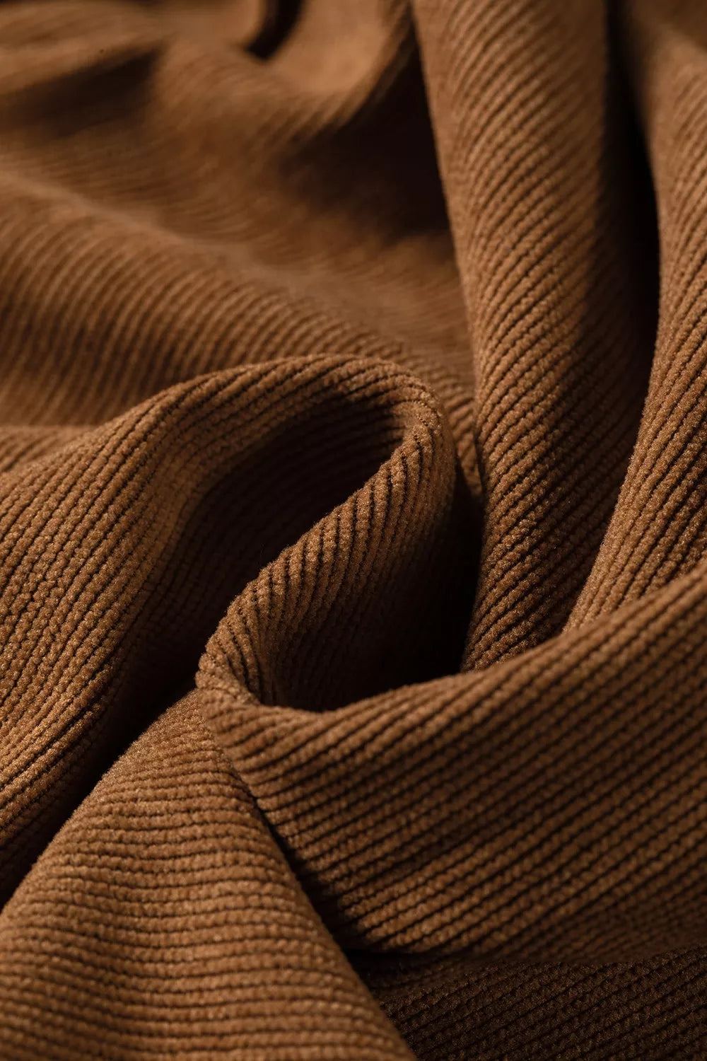 Brown button-detail wide-leg pants, corduroy fabric close-up