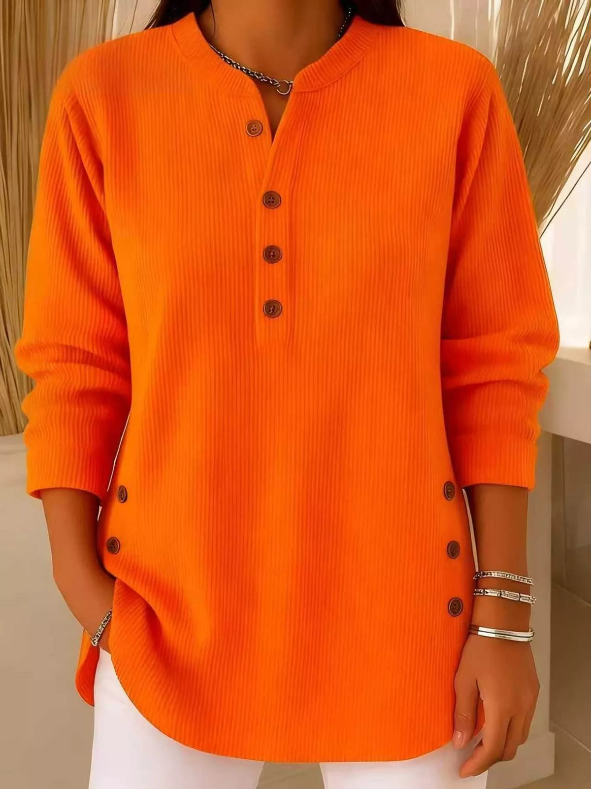 Orange button detail long sleeve top, front view