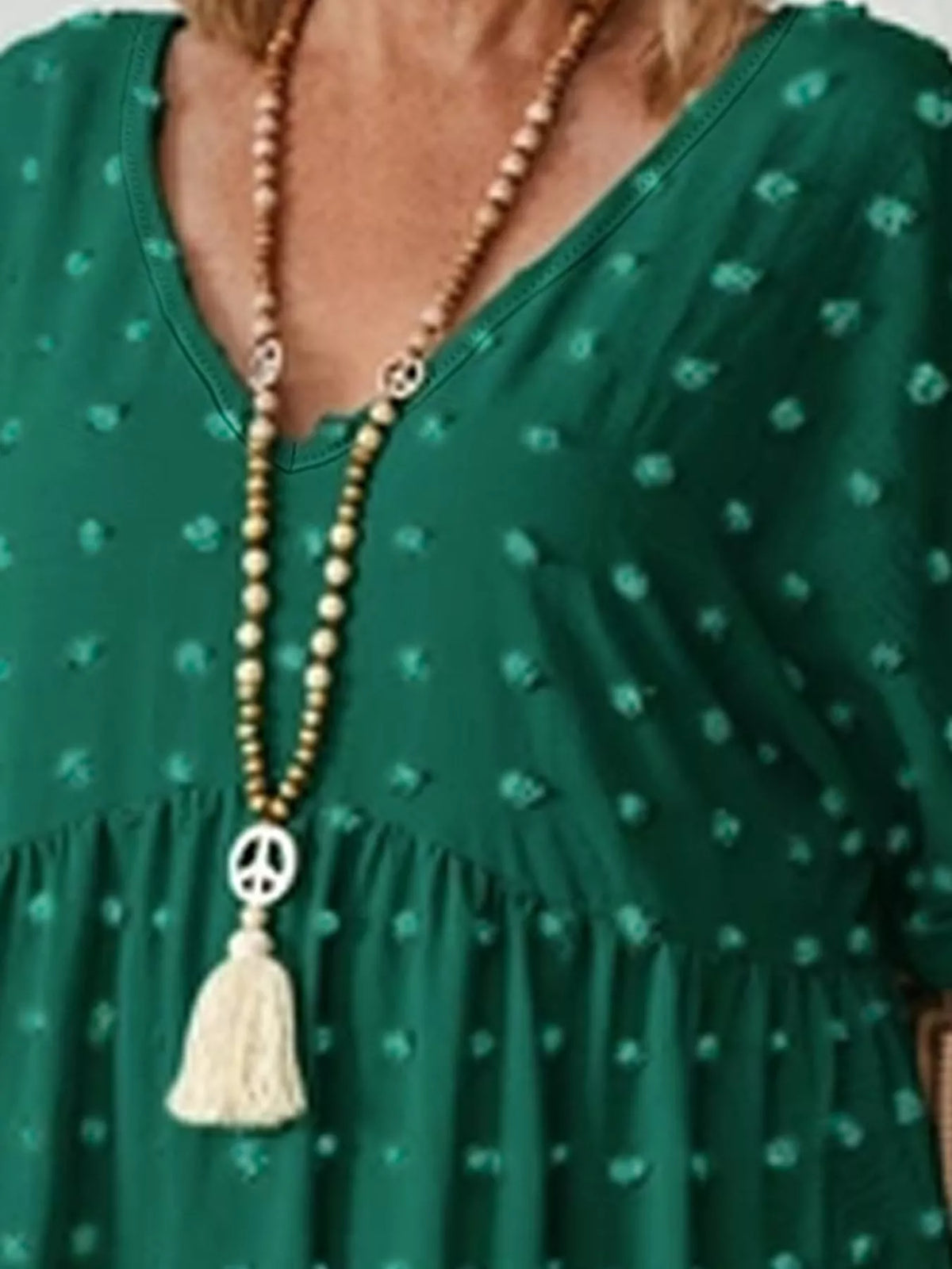 Swiss-dot blouse, dark green neckline detail