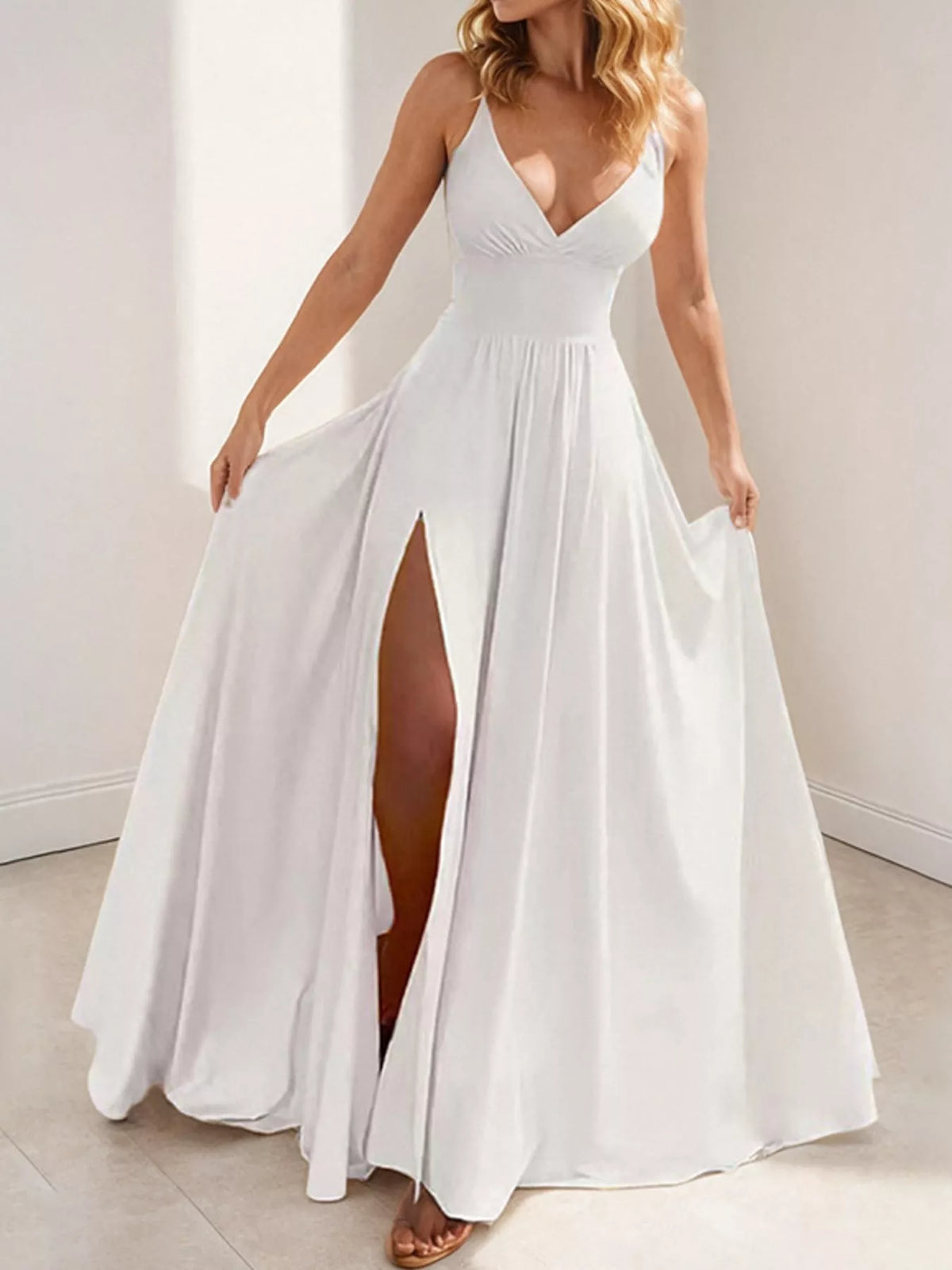 White sleeveless high slit maxi dress, front view