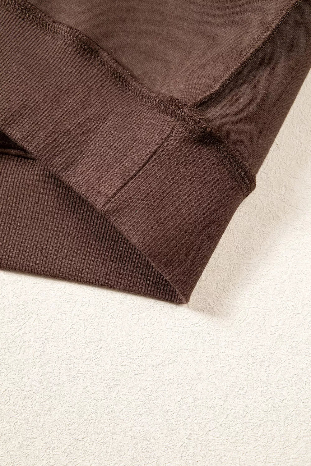 Brown wwjd patchwork graphic mock-neck sweatshirt, ribbed hem detail.