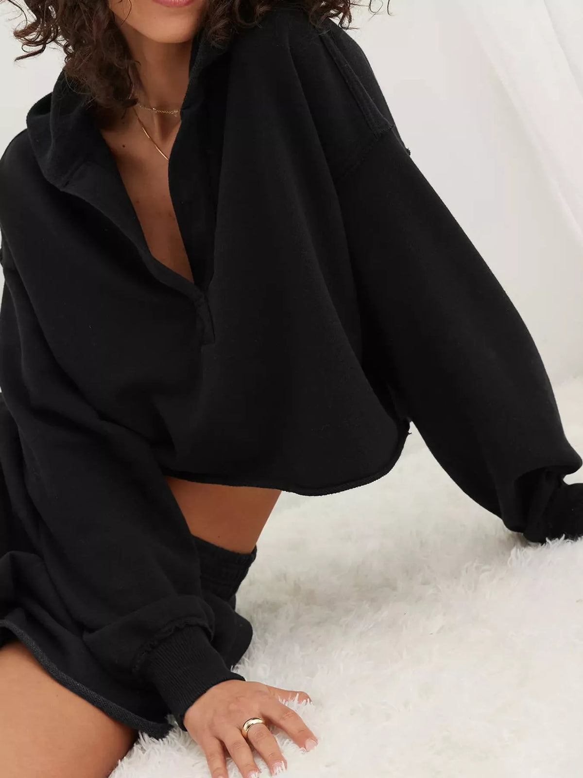 Cropped hoodie, black seated view