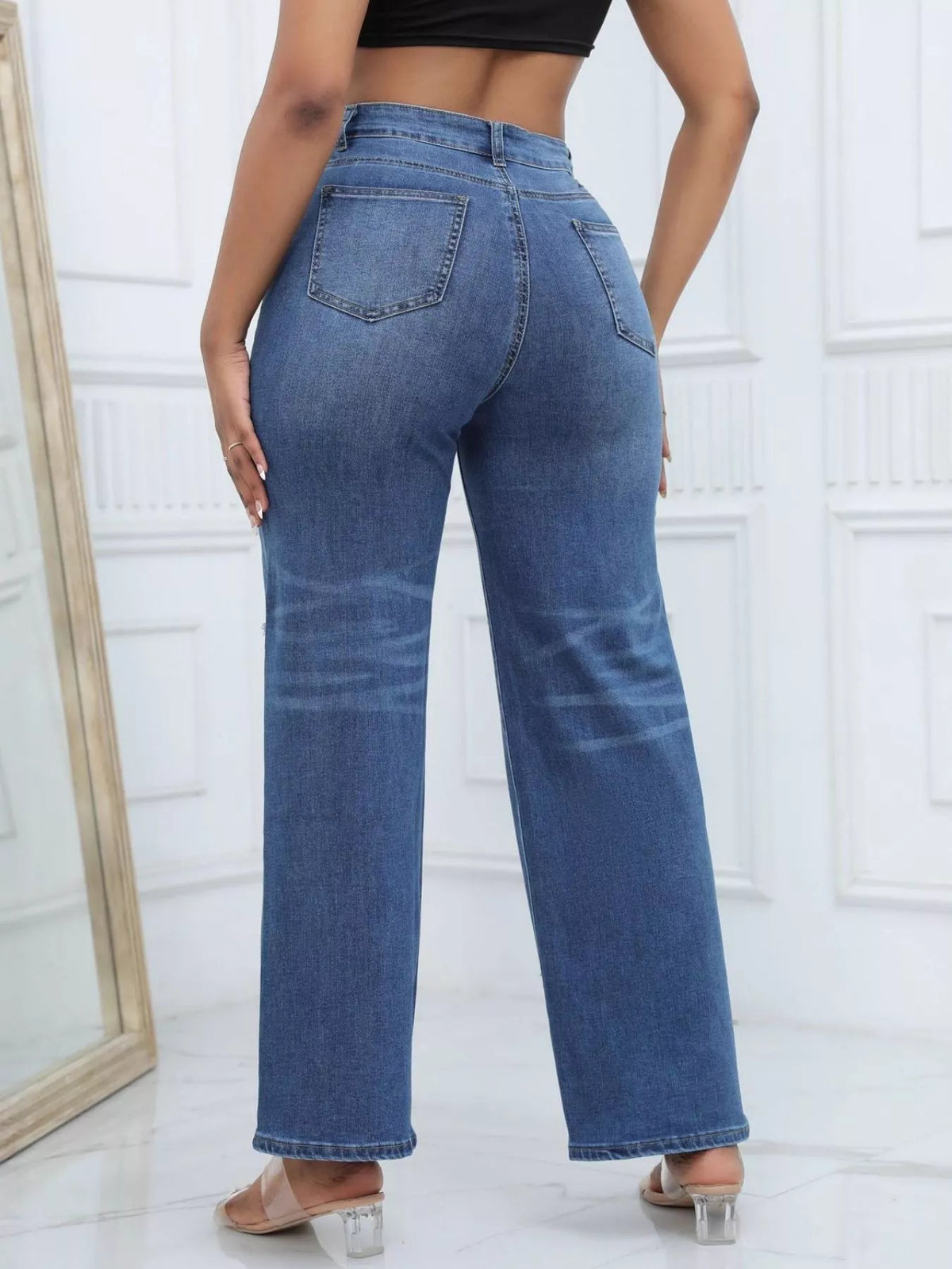 Dark blue distressed wide-leg jeans, back view
