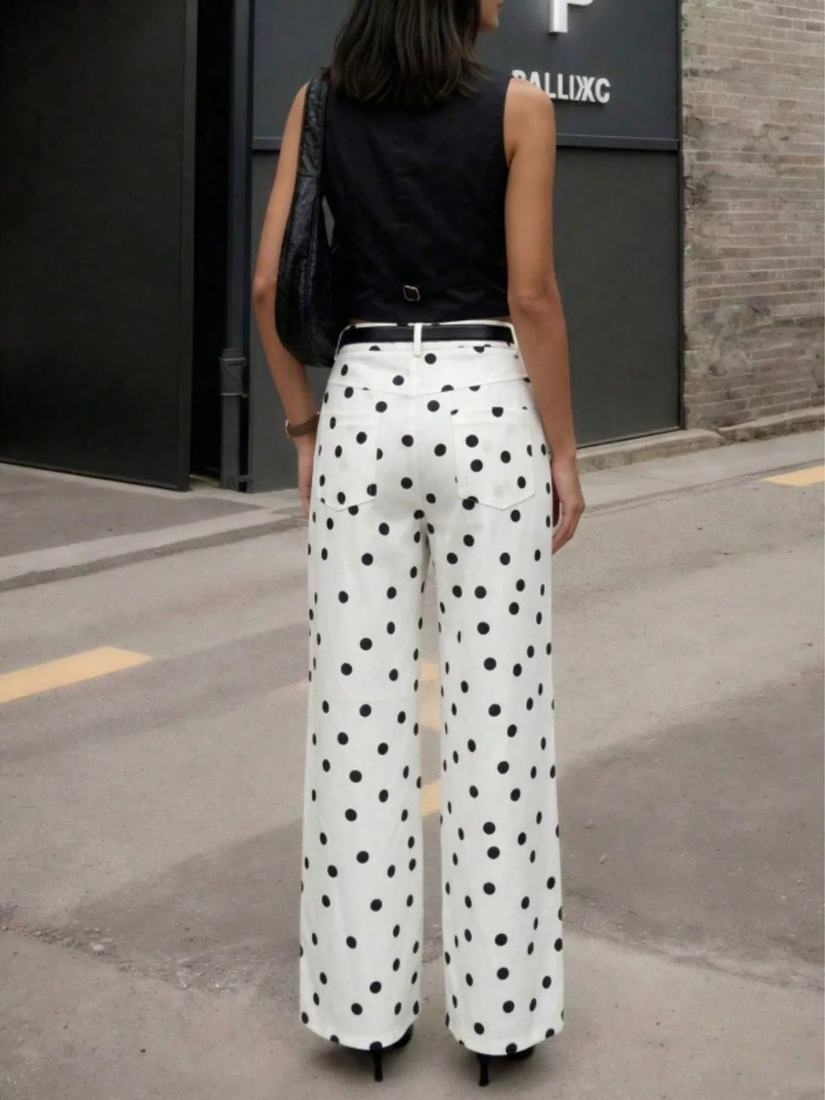 White high-waisted polka dot wide-leg pants, back view