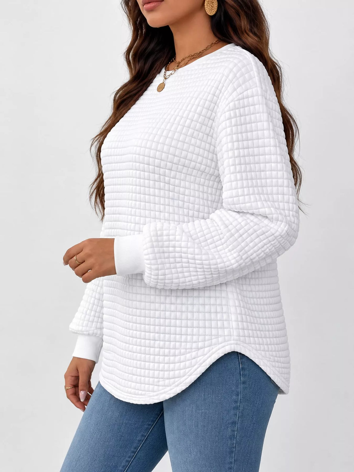 White waffle knit sweatshirt with curved hem, side view