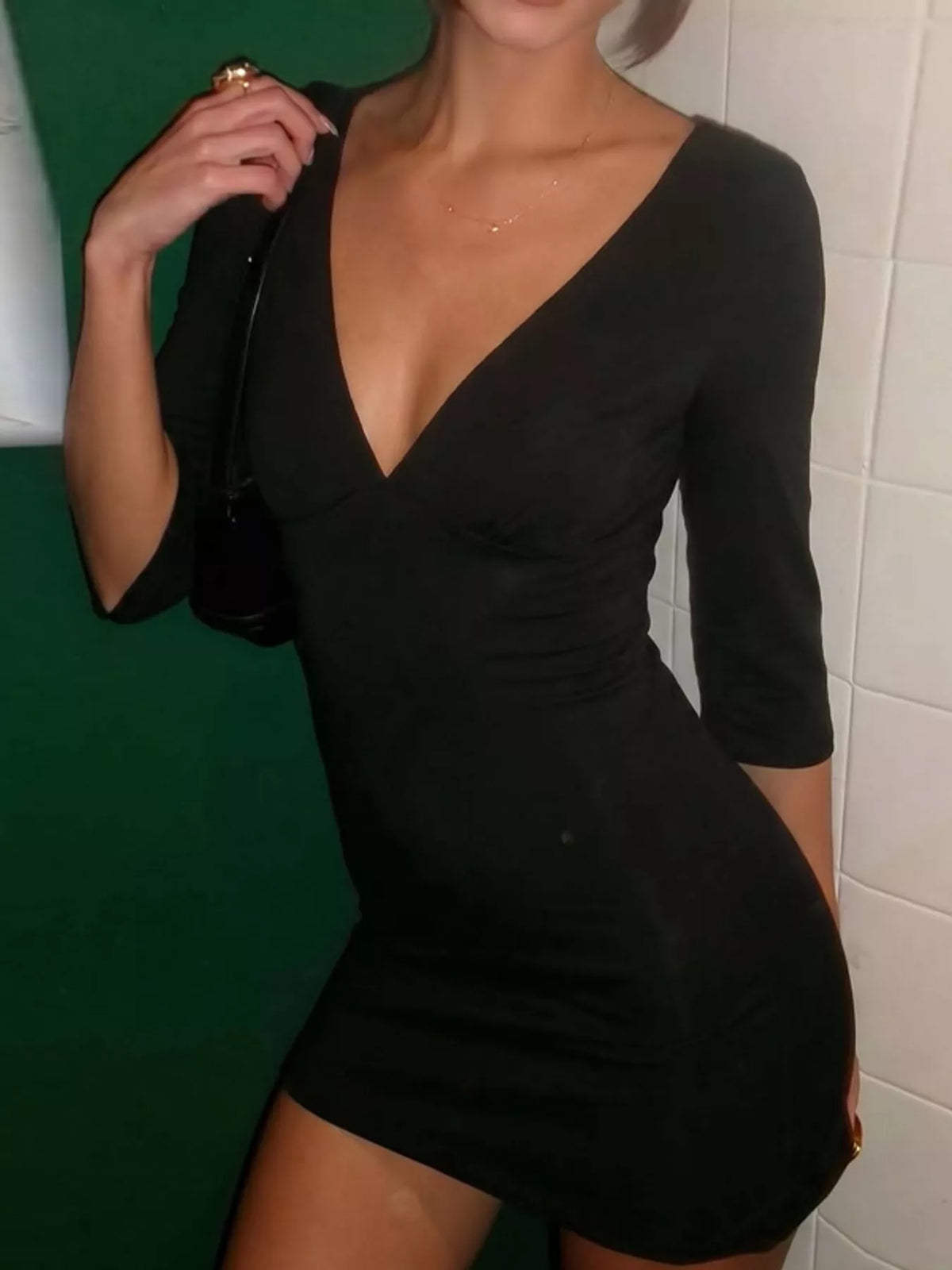 Plunging neck 3/4 sleeve mini dress, front view on model