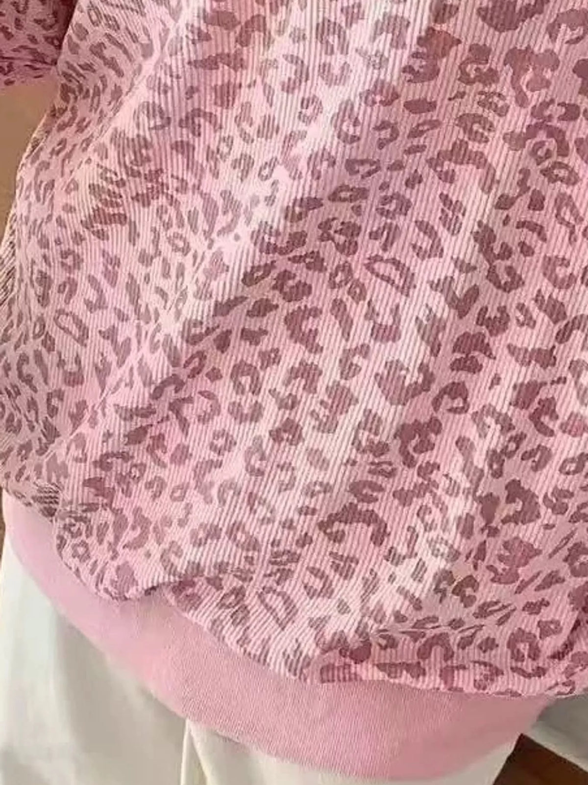 Pink leopard print quarter-zip sweatshirt, detail view