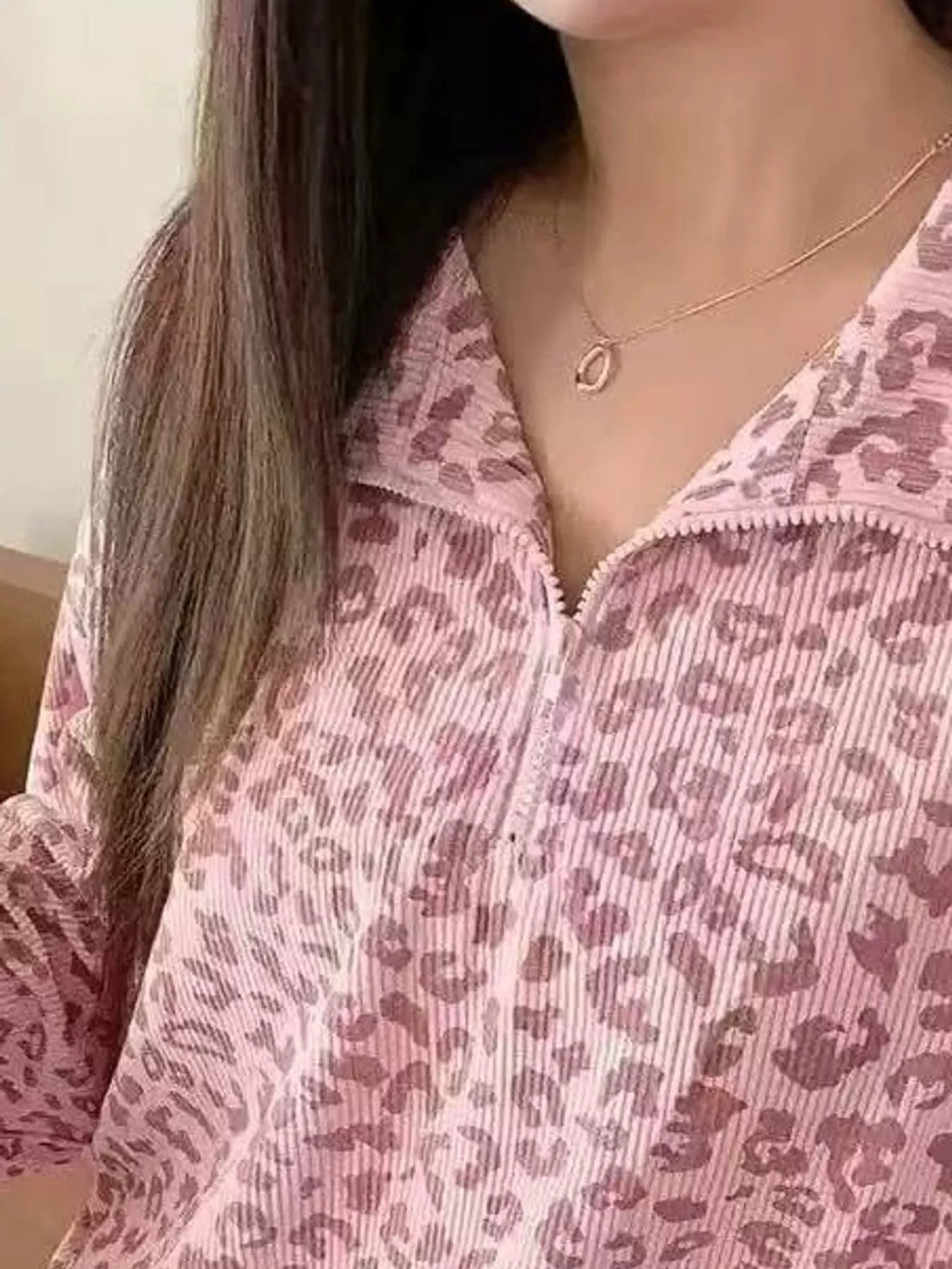 Pink leopard print quarter-zip sweatshirt, detail view