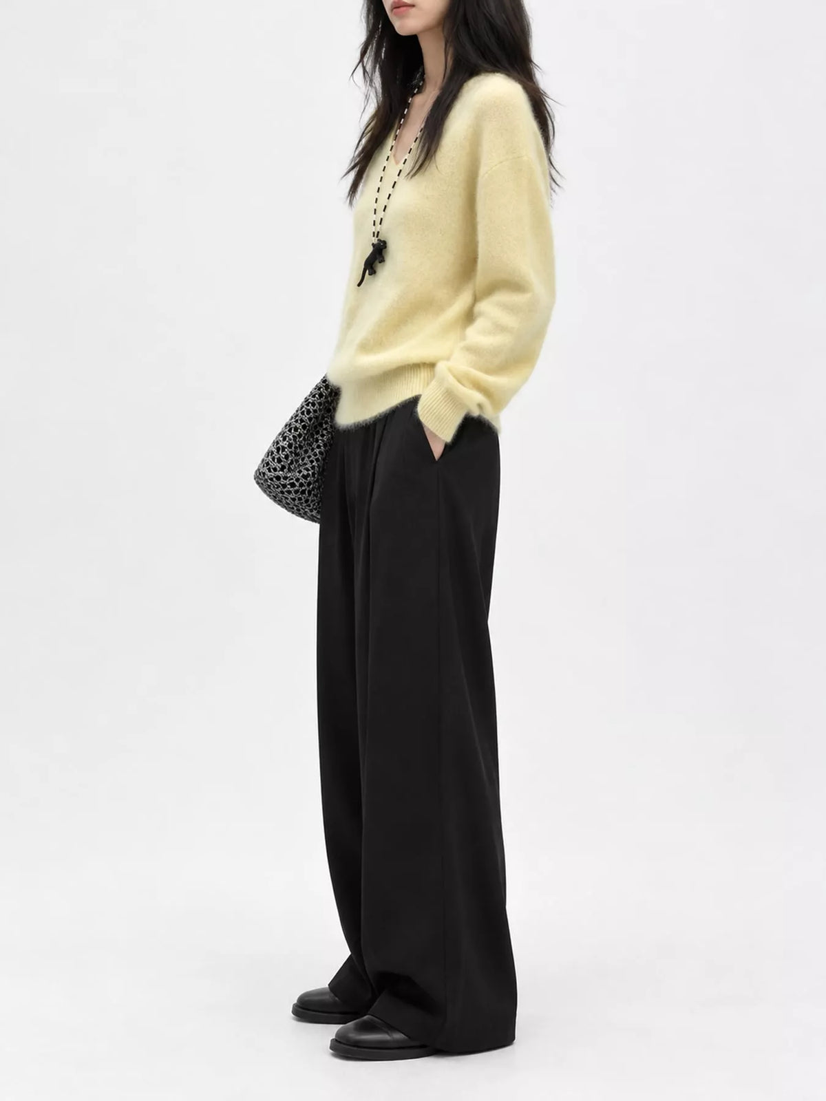 Yellow v-neck sweater, side view