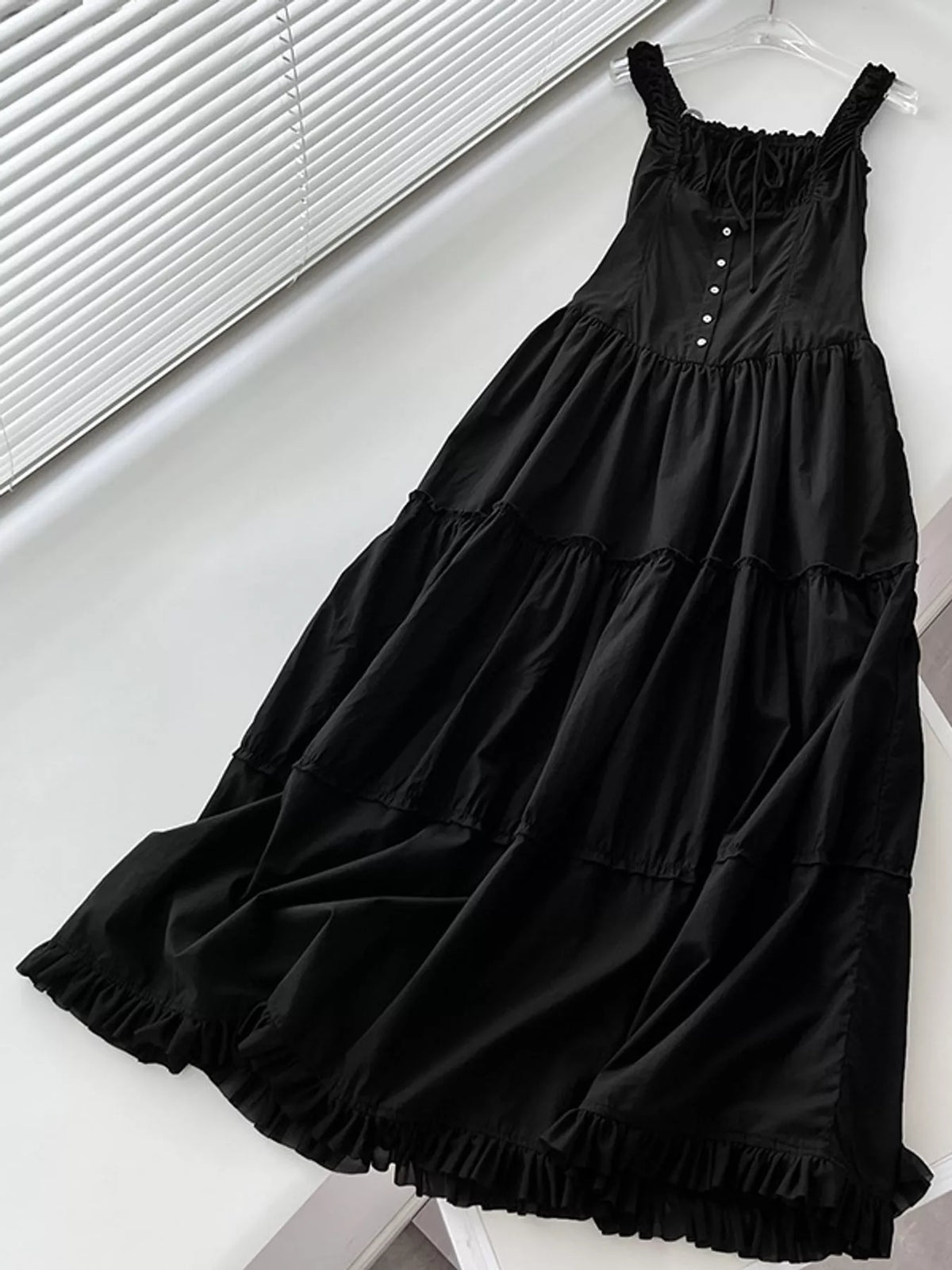 Women's Ruffled Square Neck Tiered Maxi Dress in black — flat lay view