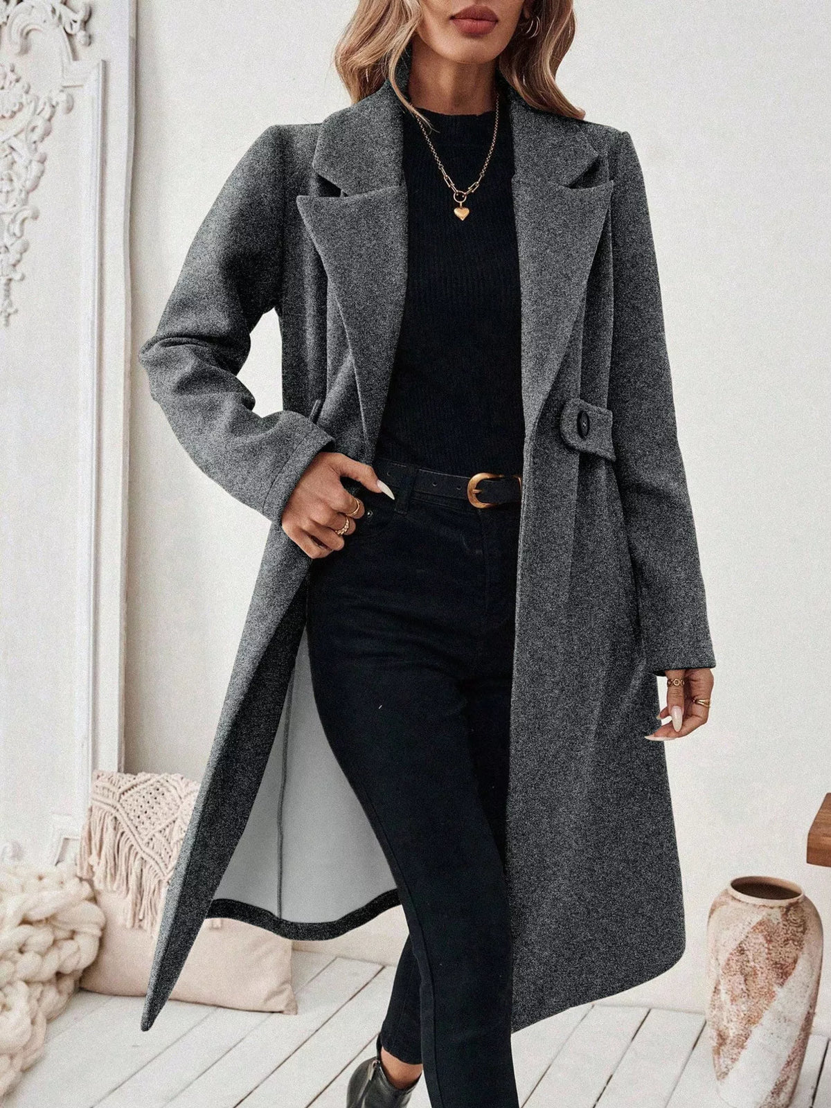 Gray lapel-collar longline coat, open front, hand at waist