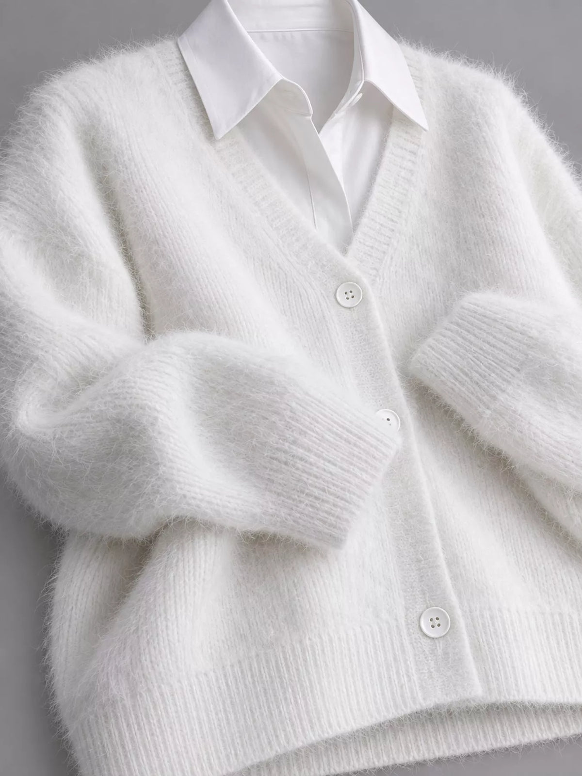 White fuzzy v-neck button-down cardigan, V-neckline and fuzzy knit button front