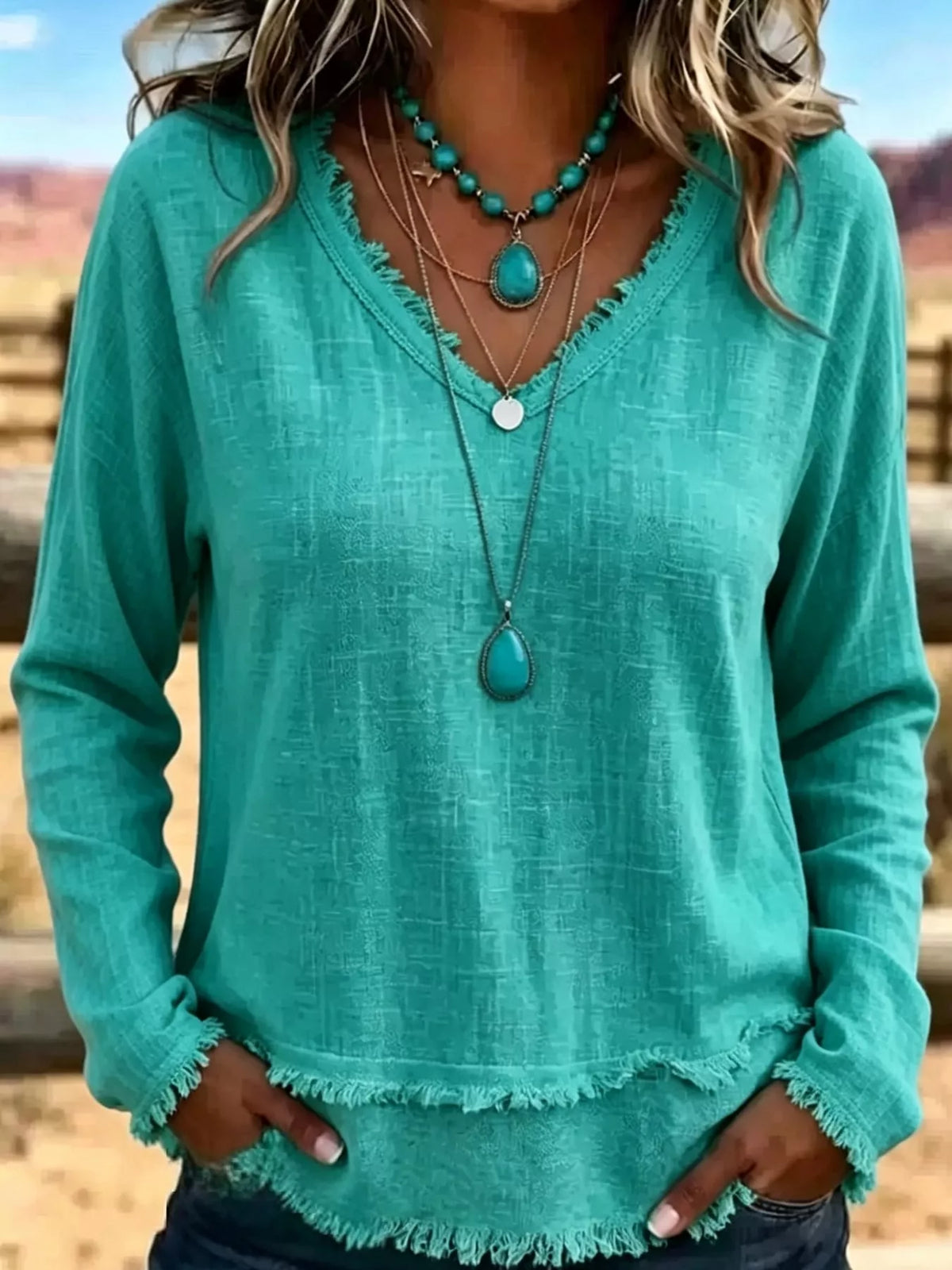 Frayed V-neck blouse, teal front