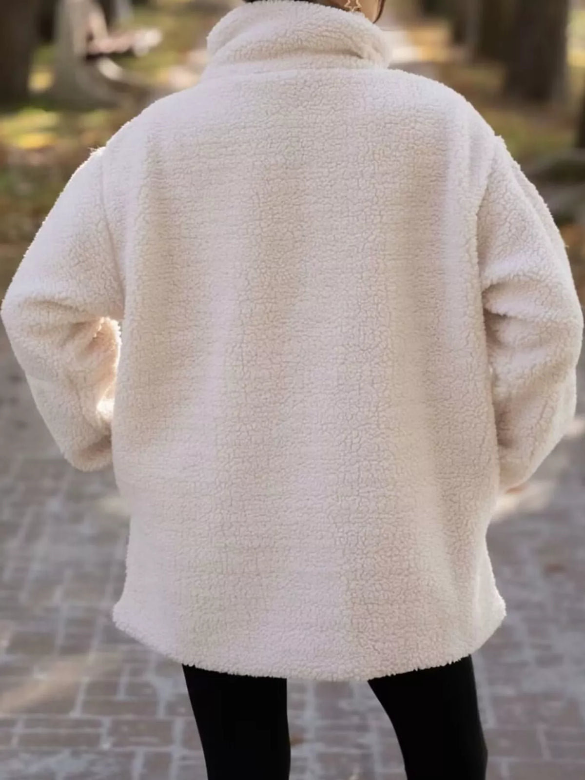 Cream sherpa zip-up jacket, back view