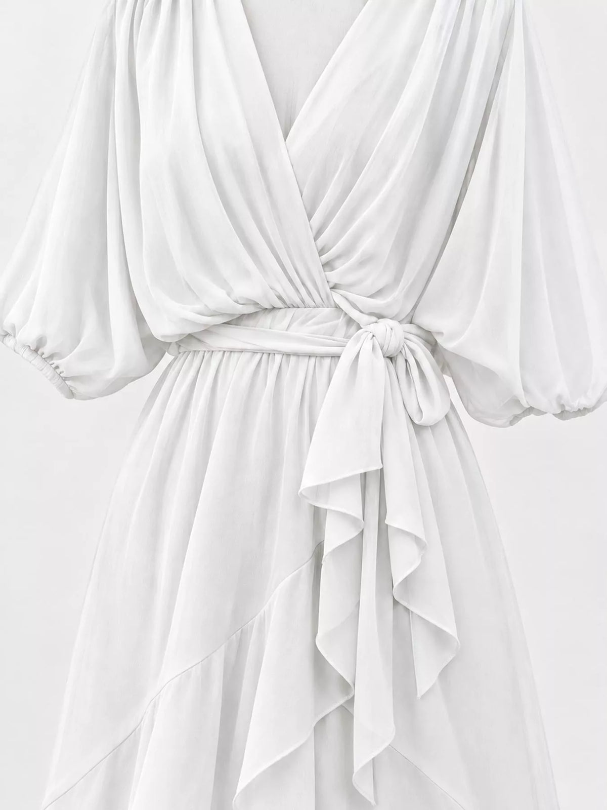 White batwing sleeve wrap dress with waist tie, detail view