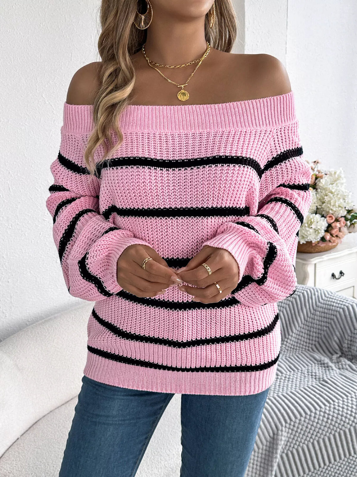 Pink off-shoulder striped sweater, untucked front view.