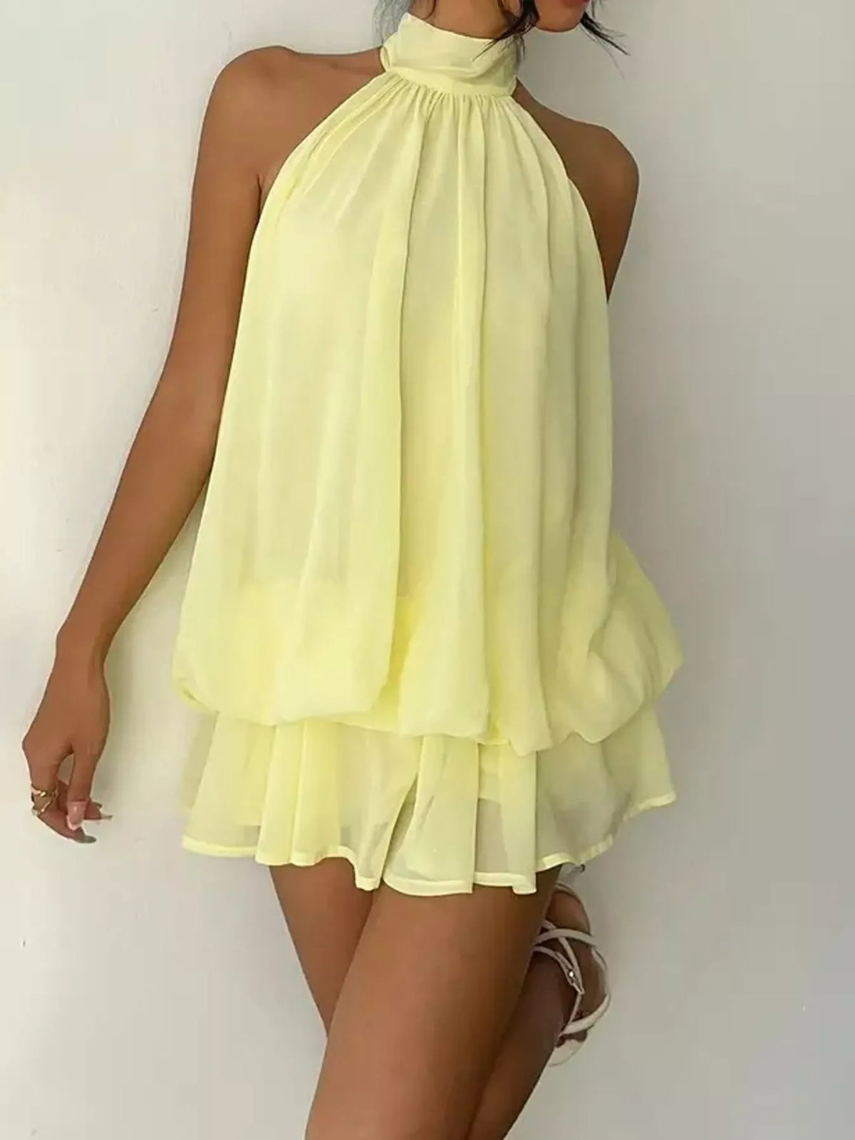 Yellow halter neck layered mini dress, front view