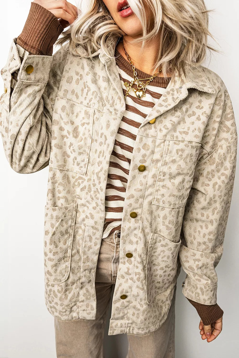 Beige leopard corduroy button-front jacket, angled front view.
