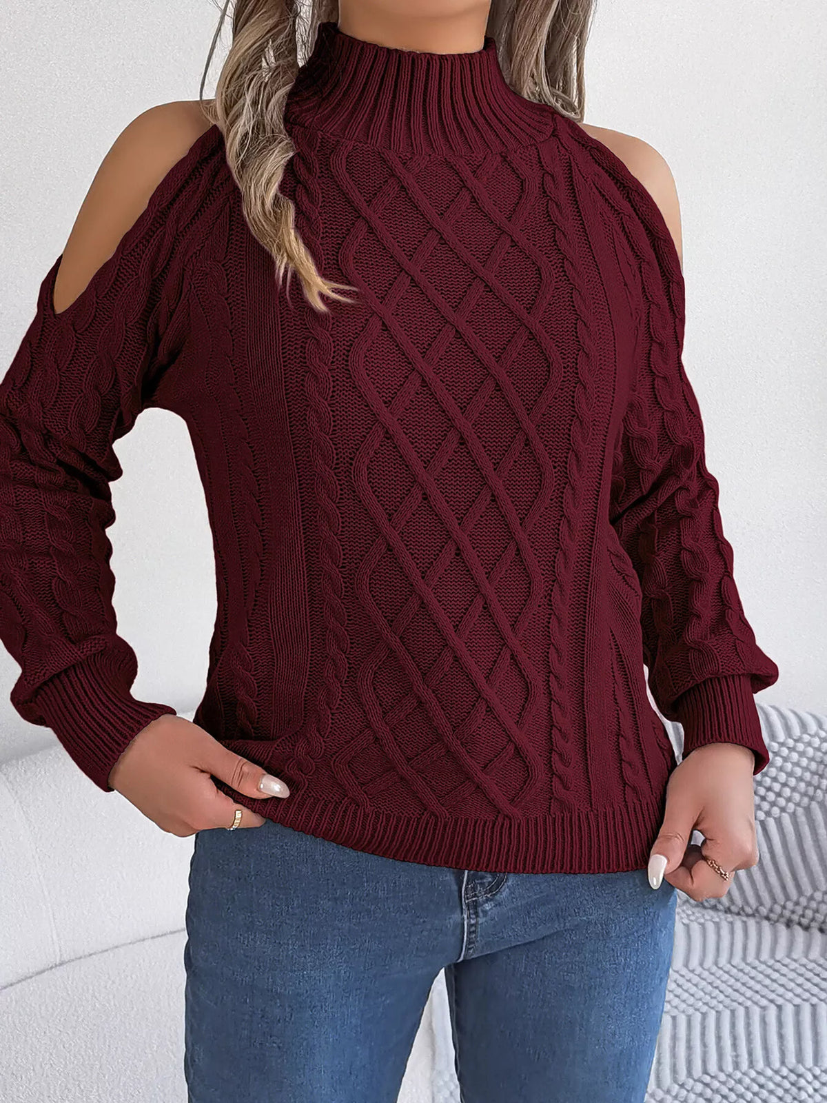 Burgundy cold-shoulder cable-knit sweater, untucked front view.