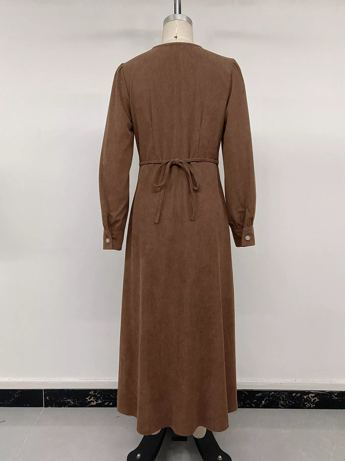 Brown corduroy button-down maxi dress, back on mannequin