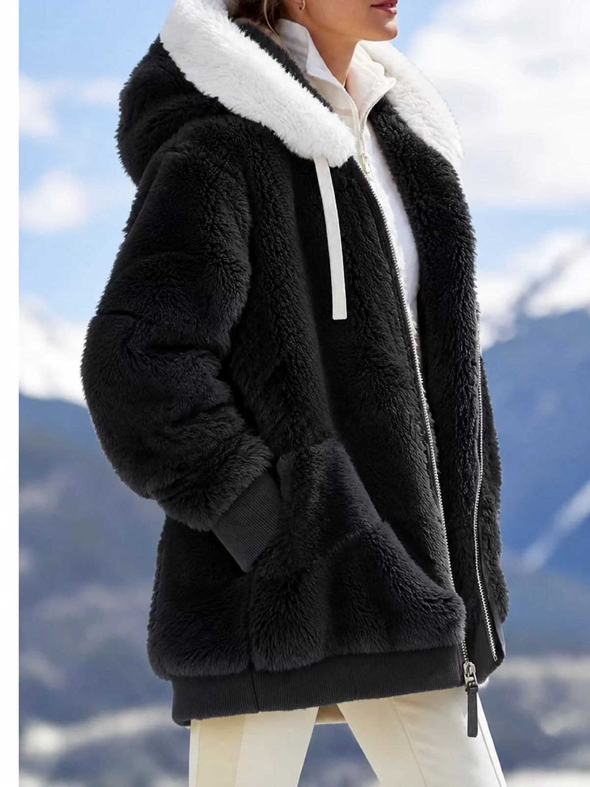 Black with white hood trim faux fur zip up hooded jacket, side view