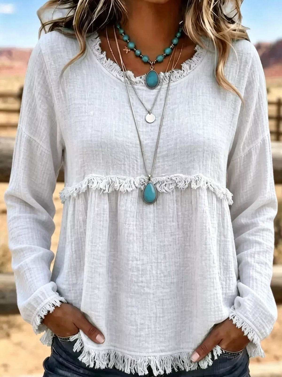 White frayed hem textured blouse, front view