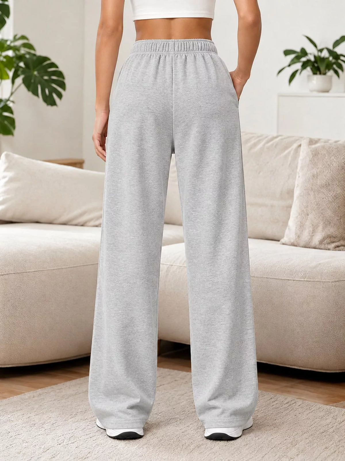 Light gray wide-leg pants with drawstring, back view