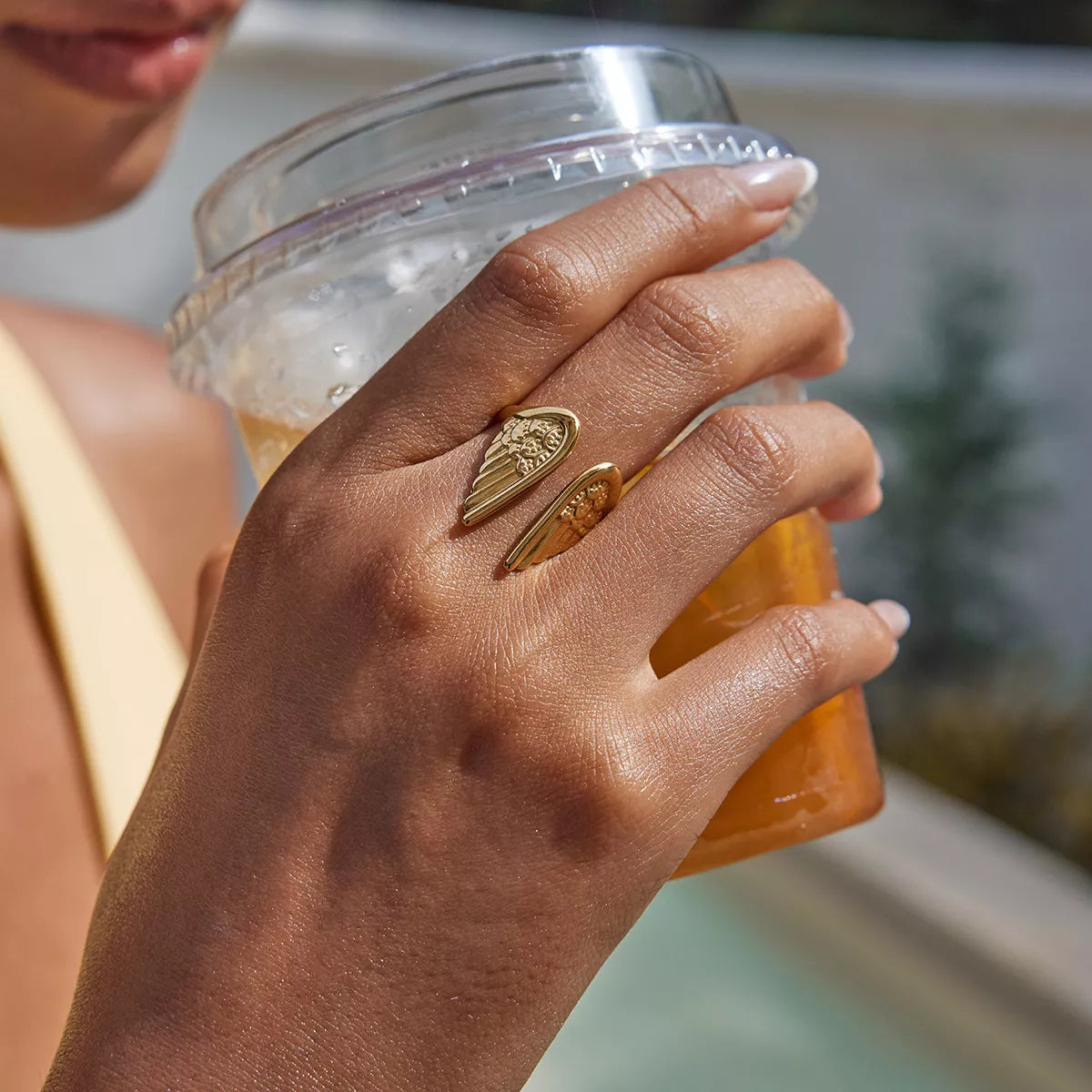 Open Wing Ring, shown worn